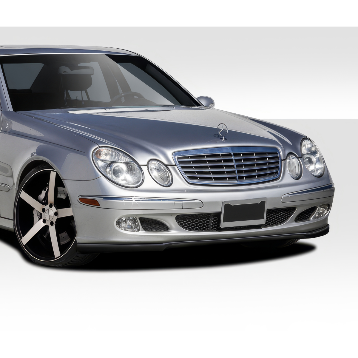 Modify your Mercedes-Benz E55 AMG 2003 with our Exterior/Front Bumpers or Lips - Front three quarter view of the vehicle