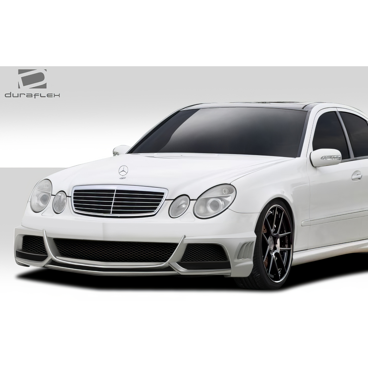 Modify your Mercedes-Benz E55 AMG 2003 with our Exterior/Front Bumpers or Lips - Front angle view of stylish white car