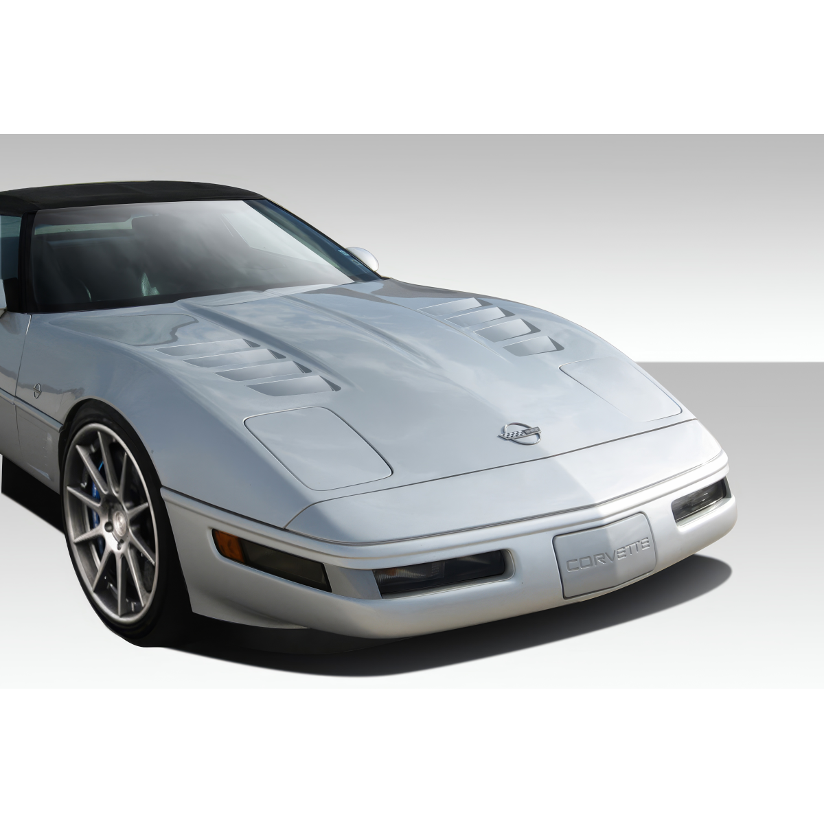 Modify your Chevrolet Corvette 1985 with our Exterior/Hoods - Front angle view of Chevrolet Corvette C4