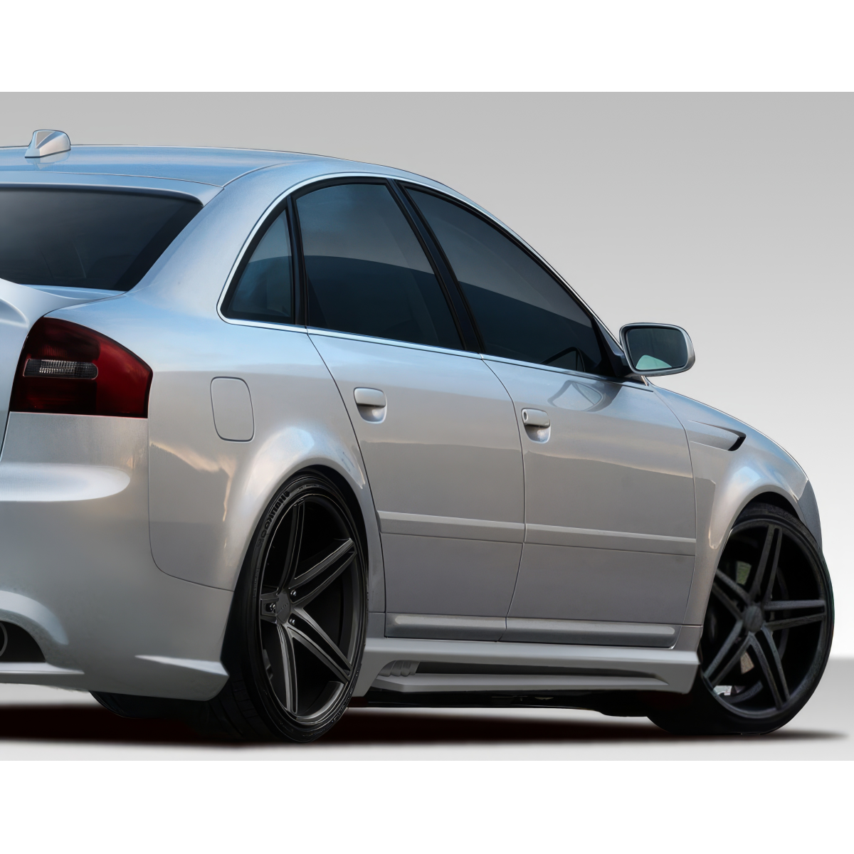 Modify your Audi A6 1998 with our Exterior/Side Skirts - Side angle view of Audi A6 with aftermarket skirts