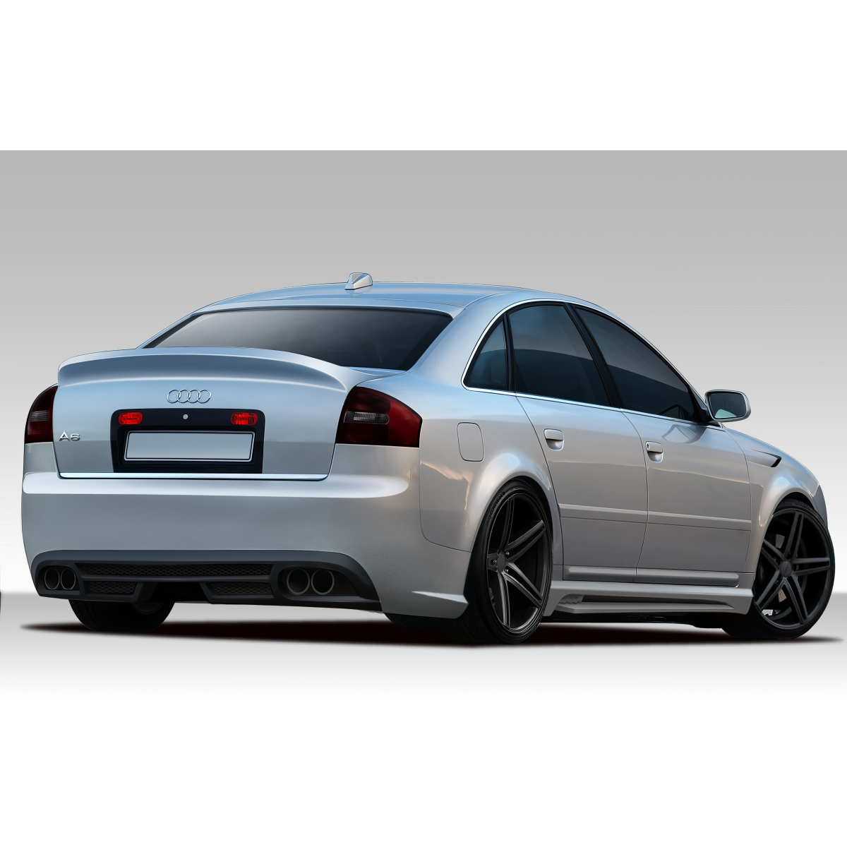 Modify your Audi A6 1998 with our Exterior/Complete Body Kits - Three quarter rear angle view of the vehicle