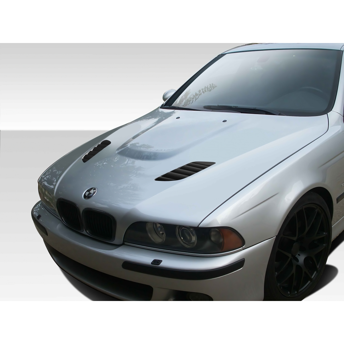 Modify your BMW 5-Series 1997 with our Exterior/Hoods - Front right angle view of the vehicle