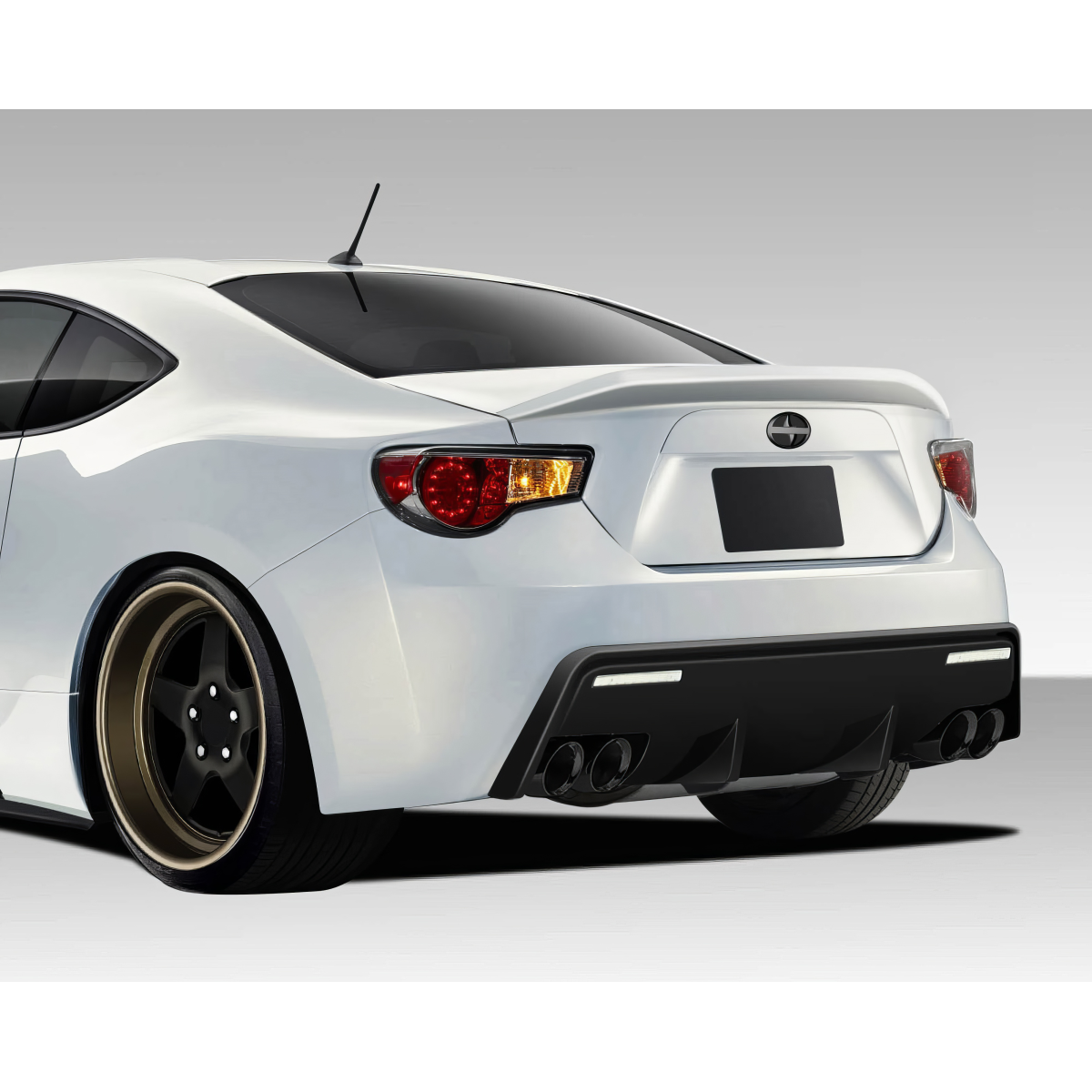 Modify your Subaru BRZ 2013 with our Exterior/Rear Bumpers or Lips - Rear angle view of a vehicle showing the bumper