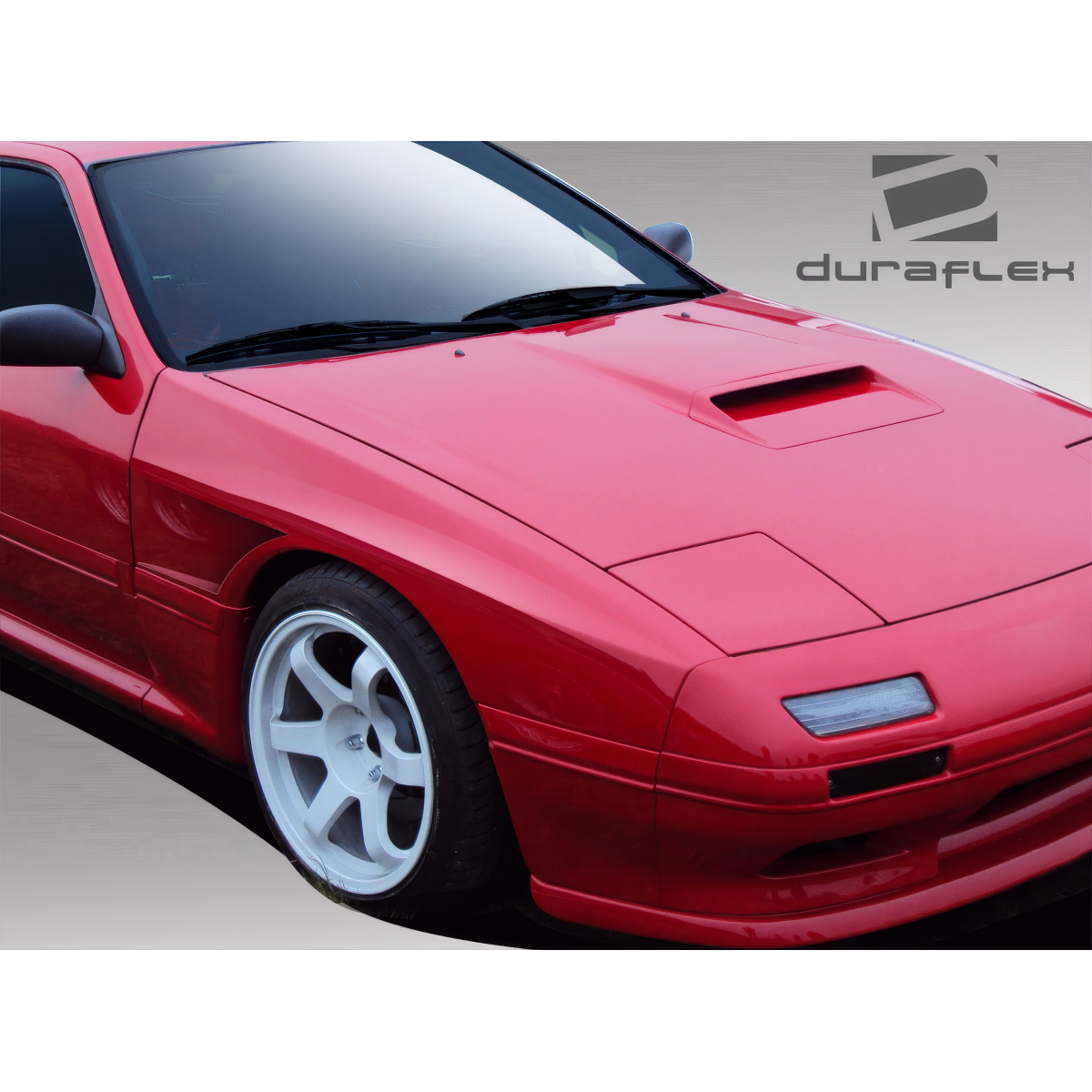 Modify your Mazda RX-7 1986 with our Exterior/Fenders - Front angle view of a red Mazda RX-7