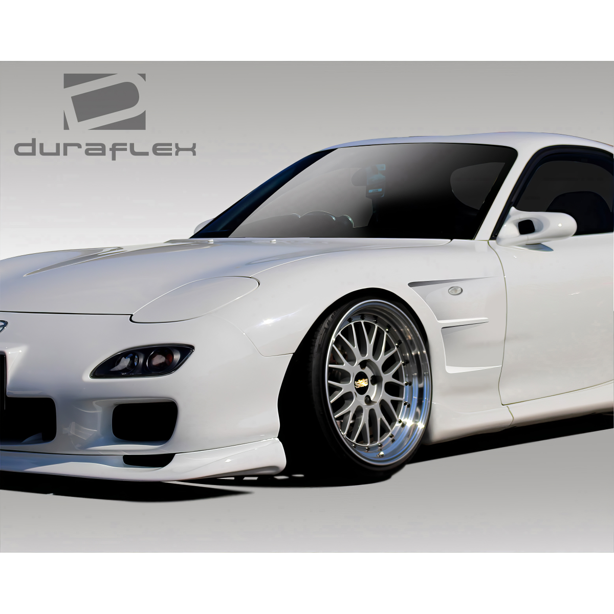 Modify your Mazda RX-7 1993 with our Exterior/Fenders - Angled view of vehicle showcasing fender details