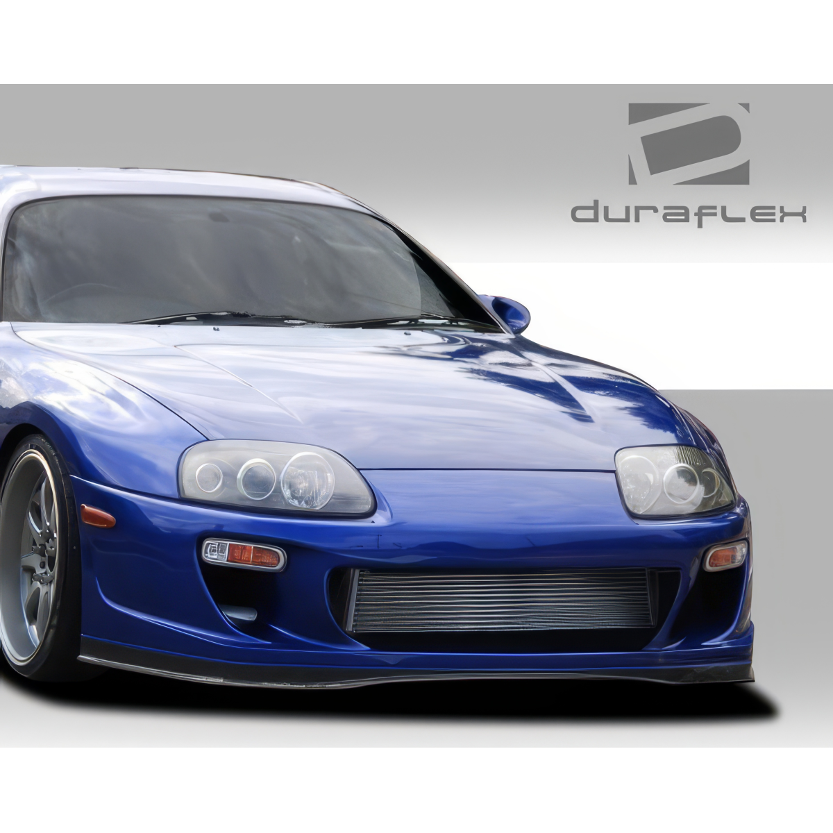 Modify your Toyota Supra 1993 with our Exterior/Front Bumpers or Lips - Front angle of a blue Toyota Supra bumper