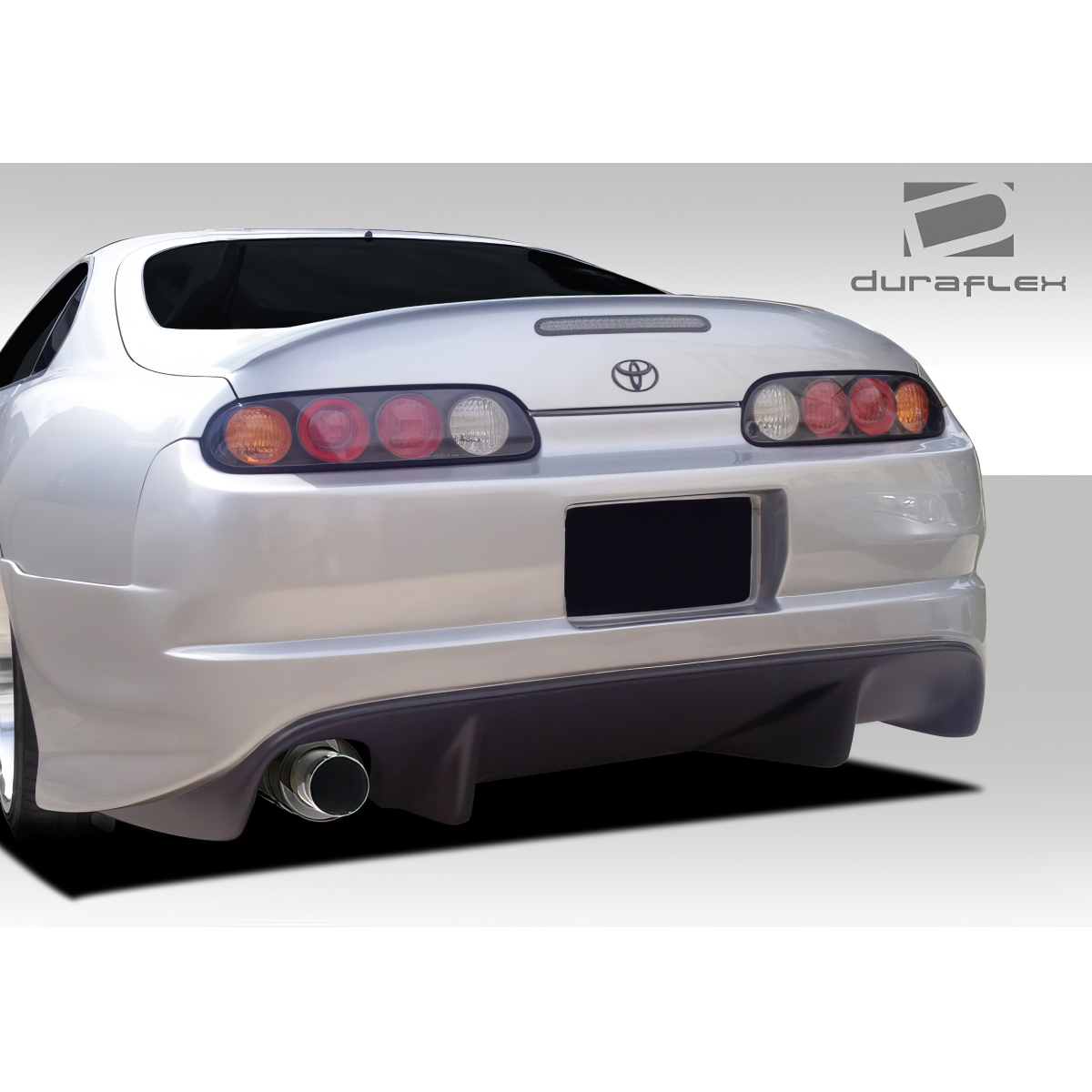 Modify your Toyota Supra 1993 with our Exterior/Rear Bumpers or Lips - Rear angle showing bumper design and exhaust