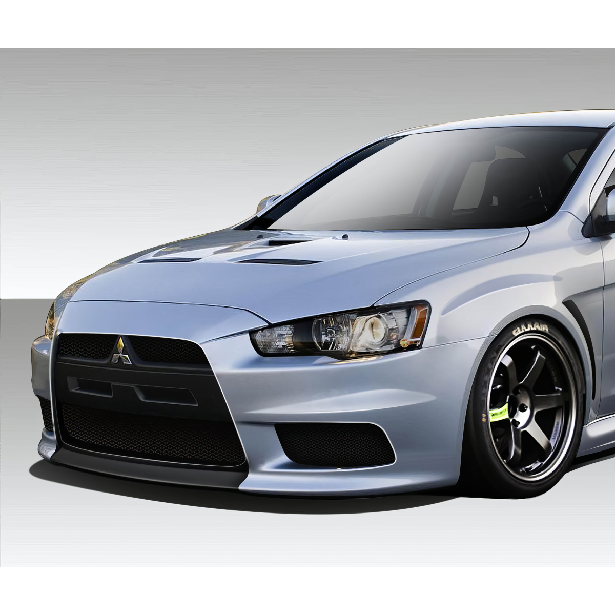 Modify your Mitsubishi Lancer 2008 with our Exterior/Complete Body Kits - Angled view showcasing the front bumper design