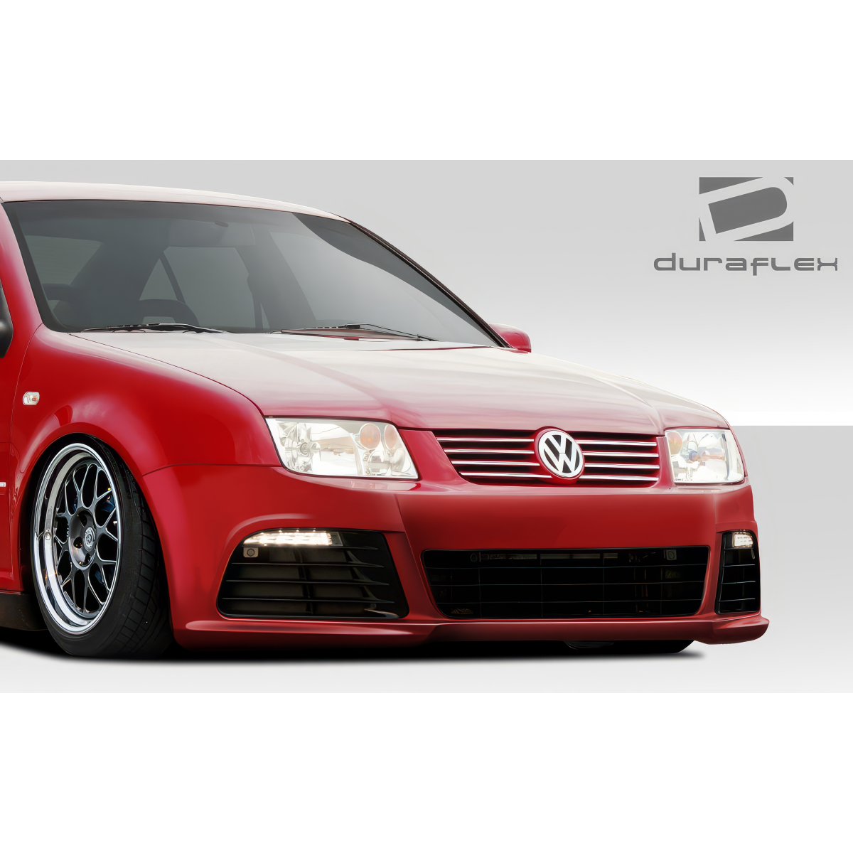 Modify your Volkswagen Jetta 1999 with our Exterior/Front Bumpers or Lips - Front angle of red Volkswagen Jetta