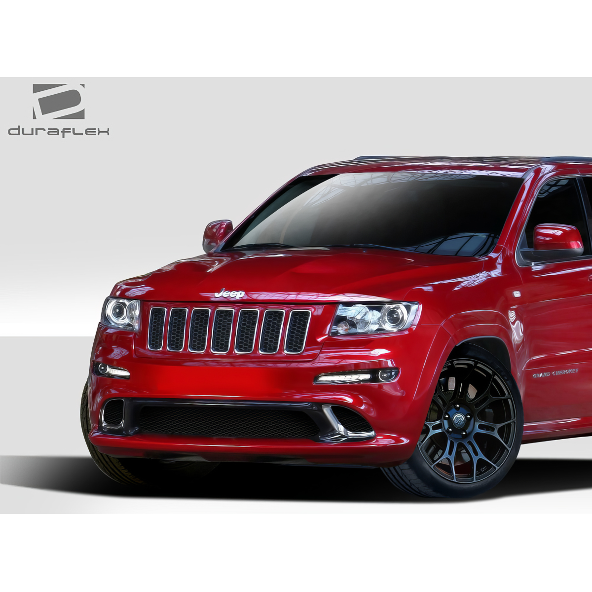 Modify your Jeep Cherokee 2011 with our Exterior/Front Bumpers or Lips - Front view of red Jeep Grand Cherokee at angle