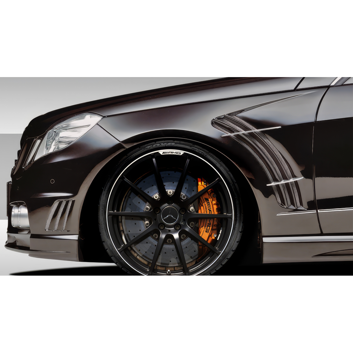 Modify your Mercedes-Benz E-Class 2010 with our Exterior/Fenders - Image shows side view of vehicle at a slight angle