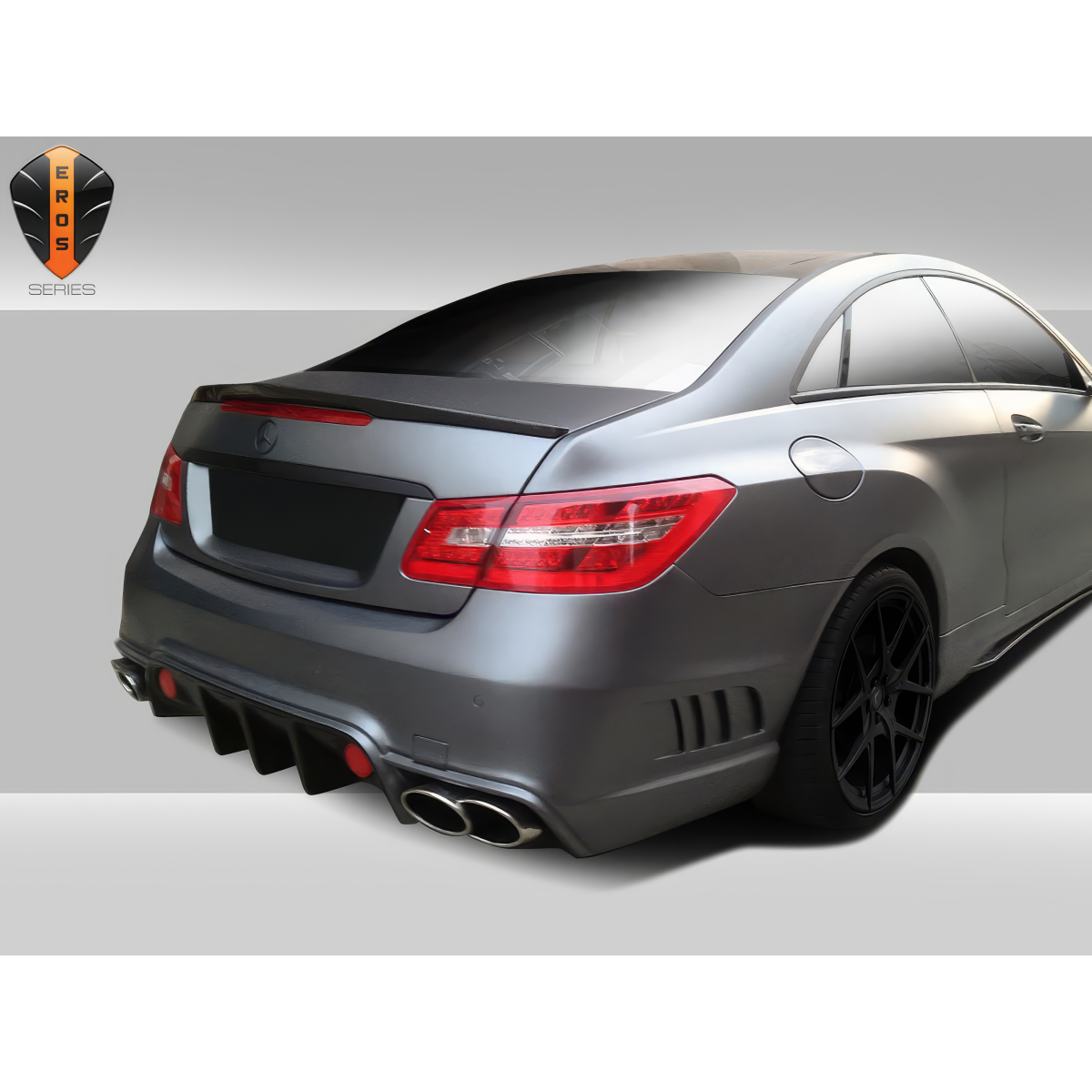 Modify your Mercedes-Benz E-Class 2010 with our Exterior/Rear Bumpers or Lips - Rear angle focused on the bumper design