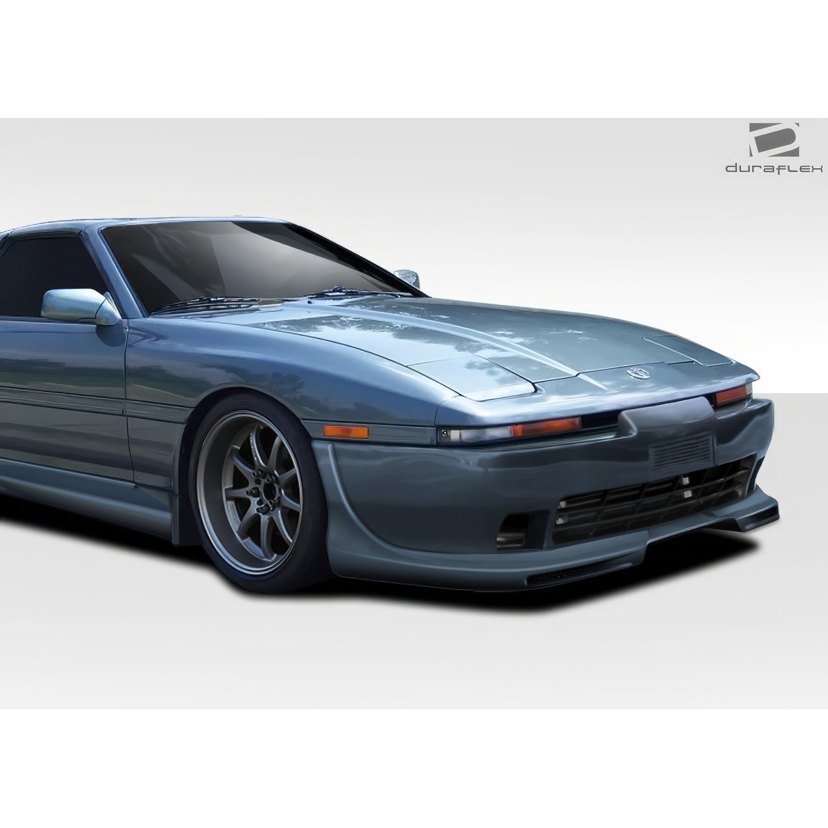 Modify your Toyota Supra 1986 with our Exterior/Front Bumpers or Lips - Front three quarter angle of the vehicle