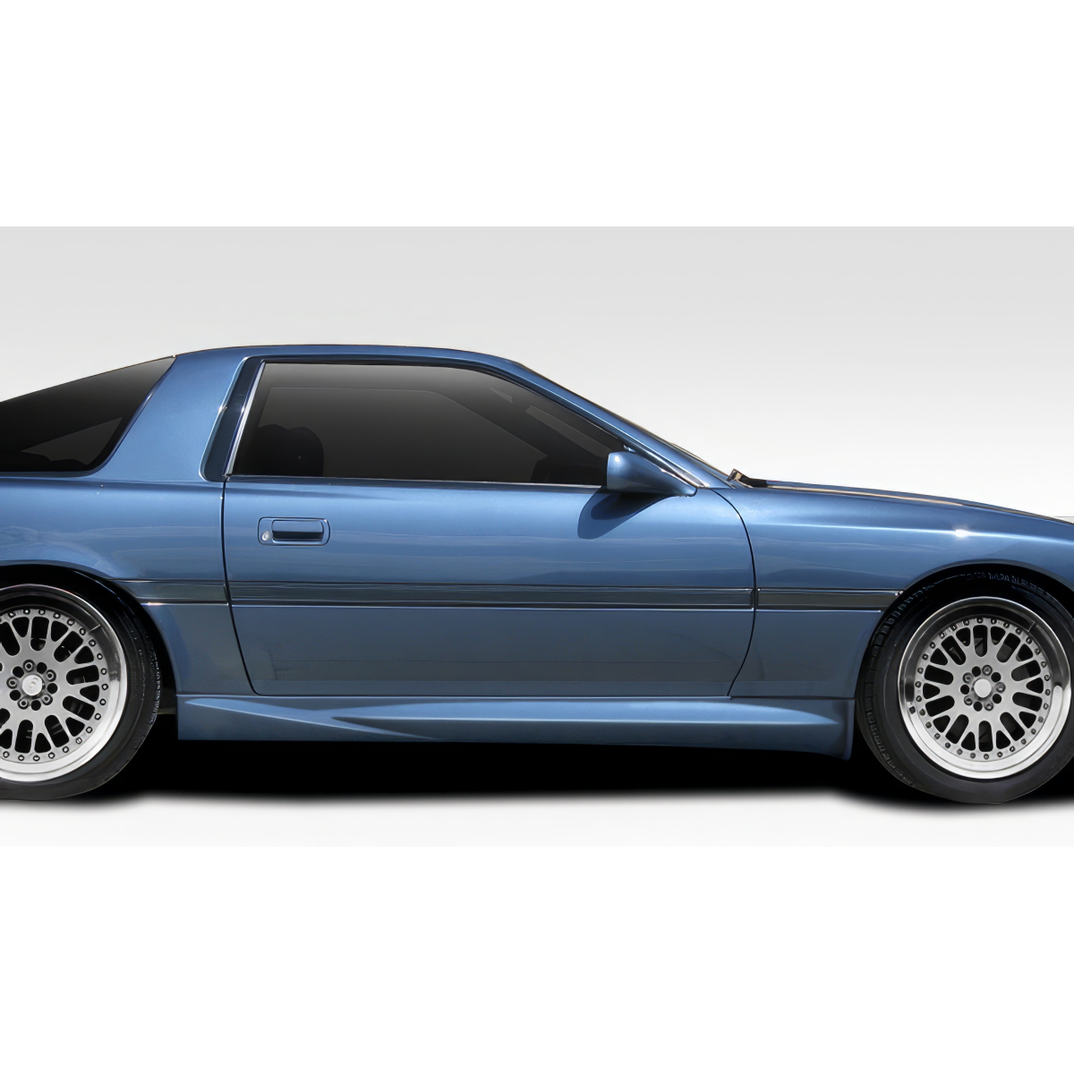 Modify your Toyota Supra 1986 with our Exterior/Side Skirts - Side view of car showing side skirts clearly