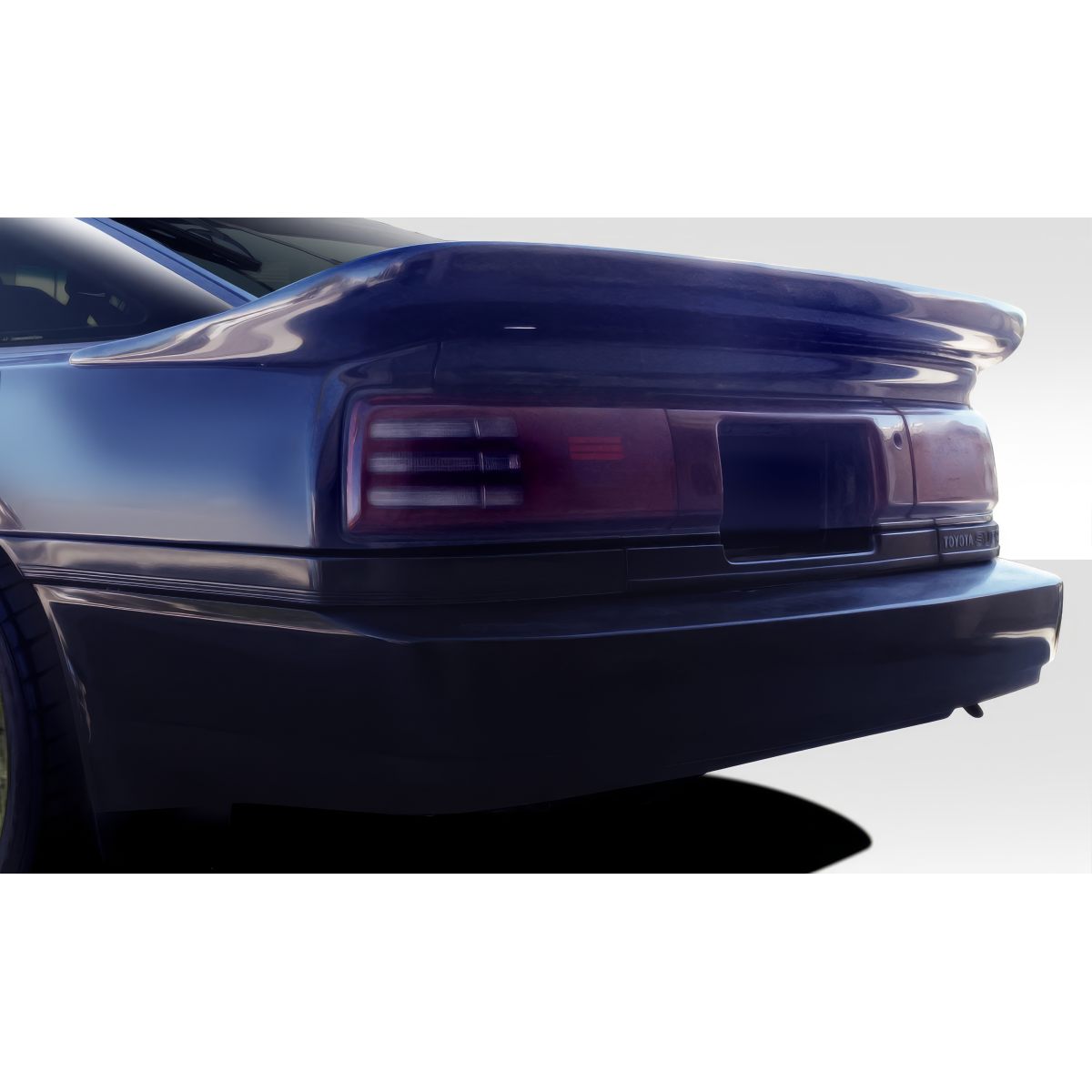 Modify your Toyota Supra 1986 with our Exterior/Wings - Rear angle view of trunk lid spoiler