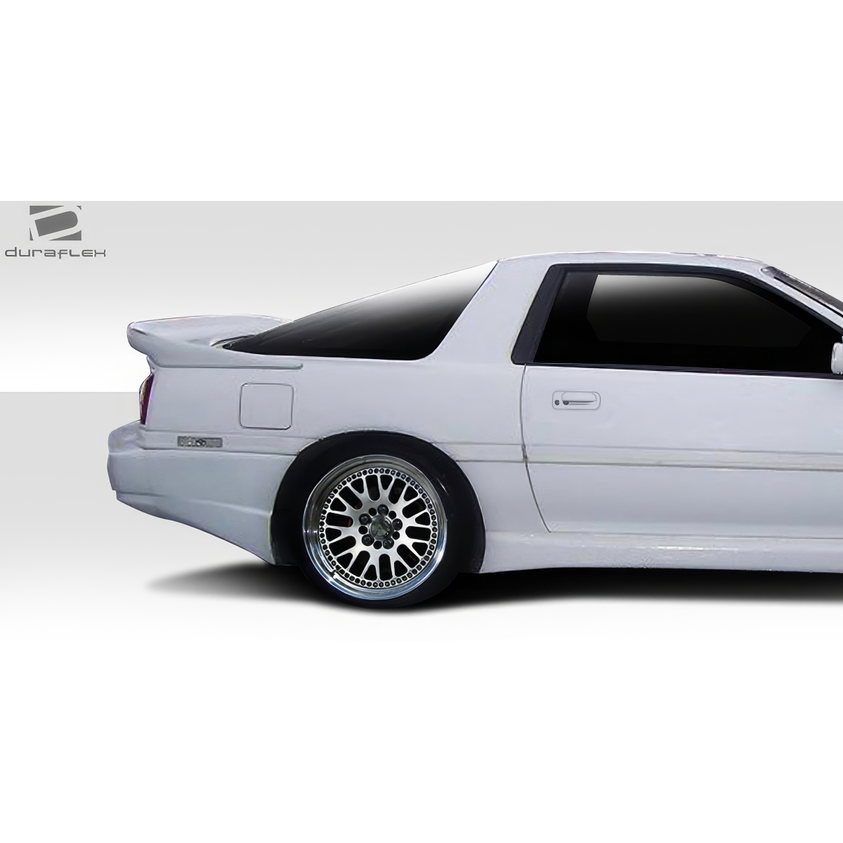 Modify your Toyota Supra 1986 with our Exterior/Wings - Side angle view of car spoiler part