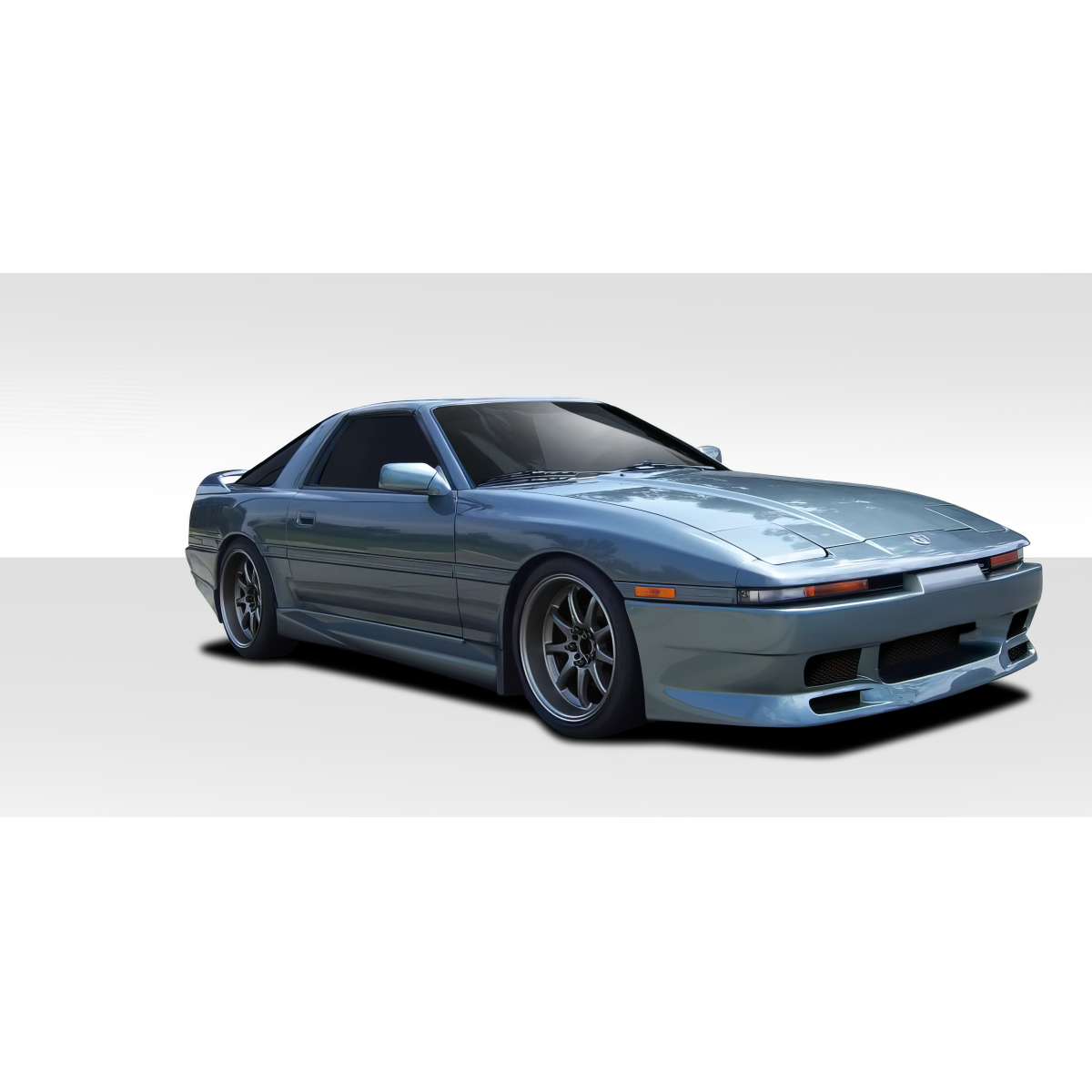 Modify your Toyota Supra 1986 with our Exterior/Complete Body Kits - Front three quarter angle of a car