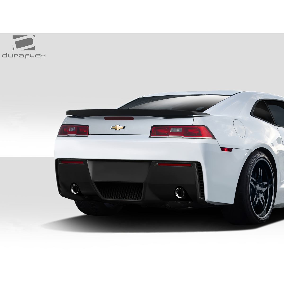 Modify your Chevrolet Camaro 2014 with our Exterior/Rear Bumpers or Lips - Rear view at a slight angle showing bumper design