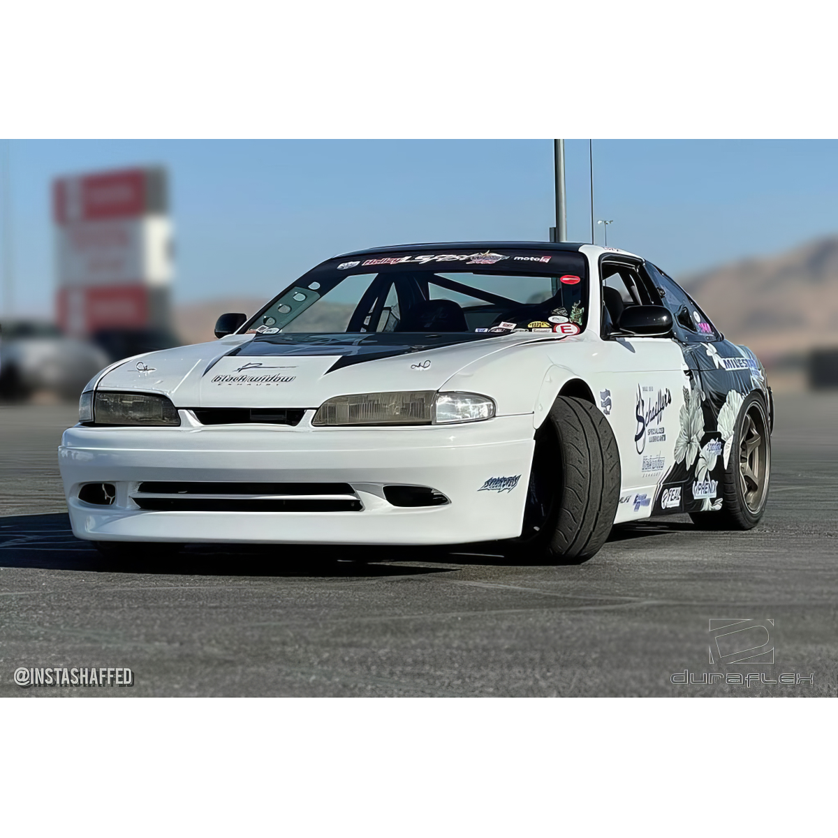 Modify your Nissan 240SX 1995 with our Exterior/Front Bumpers or Lips - Front view at a low angle showing vehicle features