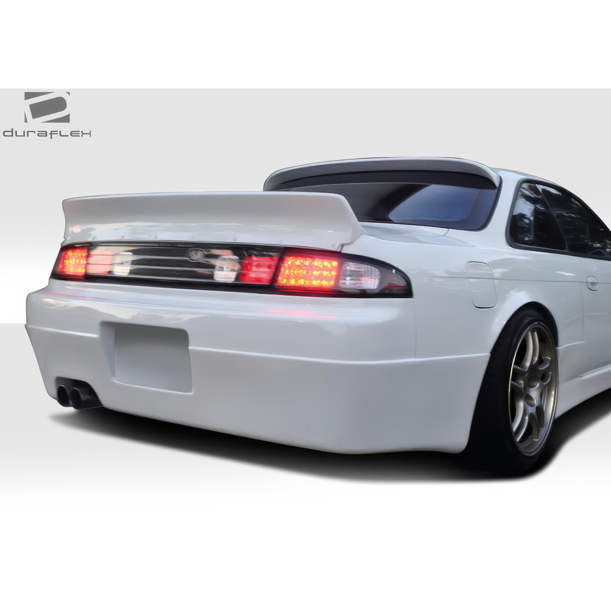 Modify your Nissan 240SX 1995 with our Exterior/Rear Bumpers or Lips - Rear angle showing bumper and taillights