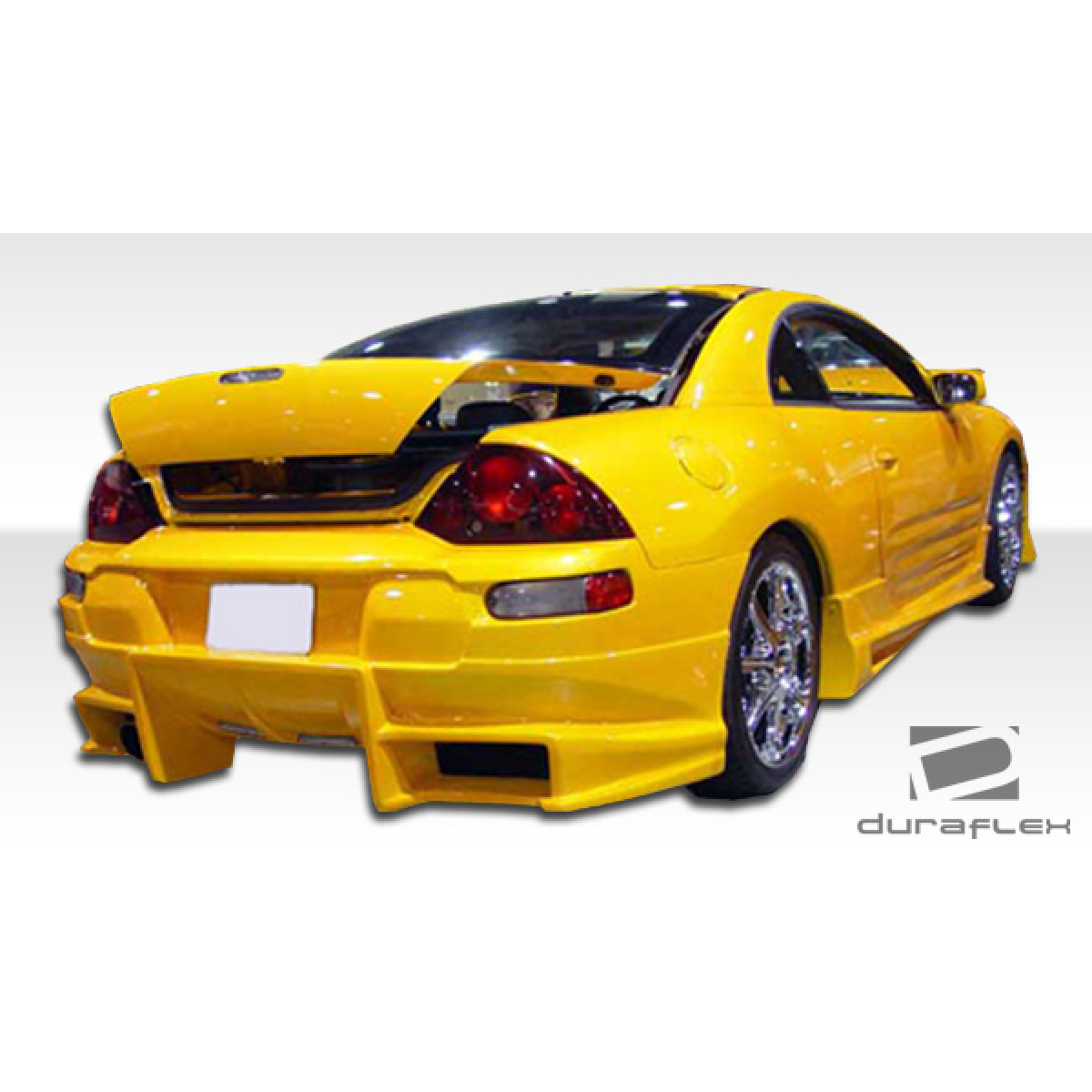 Modify your Mitsubishi Eclipse 2000 with our Exterior/Complete Body Kits - Rear angle view of yellow Mitsubishi Eclipse body kit