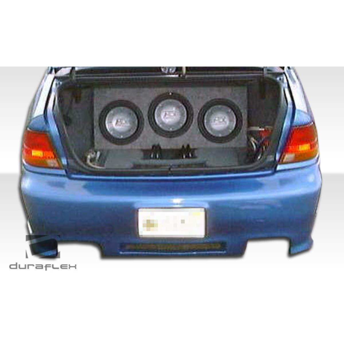 Modify your Saturn SL 1996 with our Exterior/Complete Body Kits - Rear angle view of car trunk with speakers