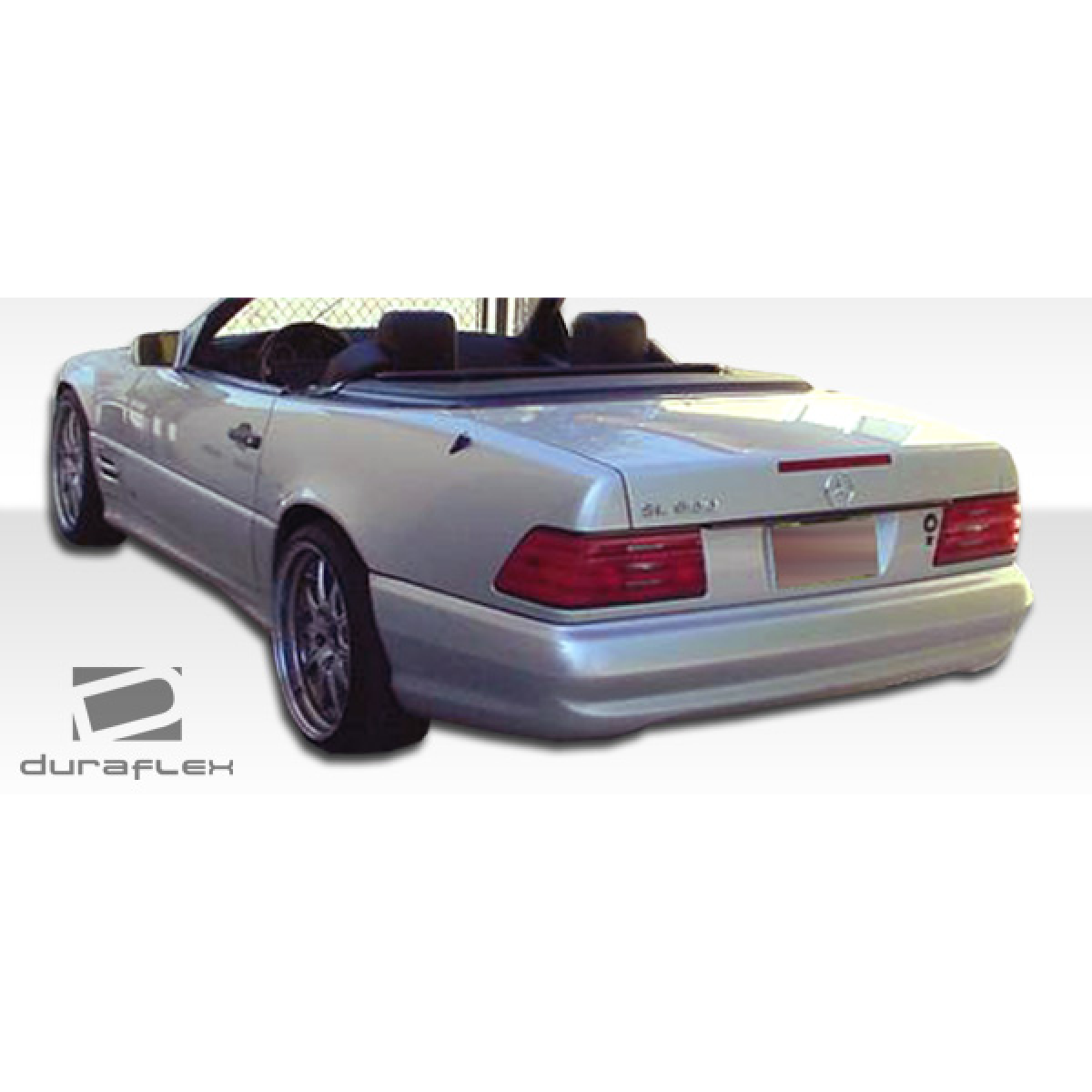 Modify your Mercedes-Benz SL-Class 1990 with our Exterior/Complete Body Kits - Rear three quarter angle view of the vehicle