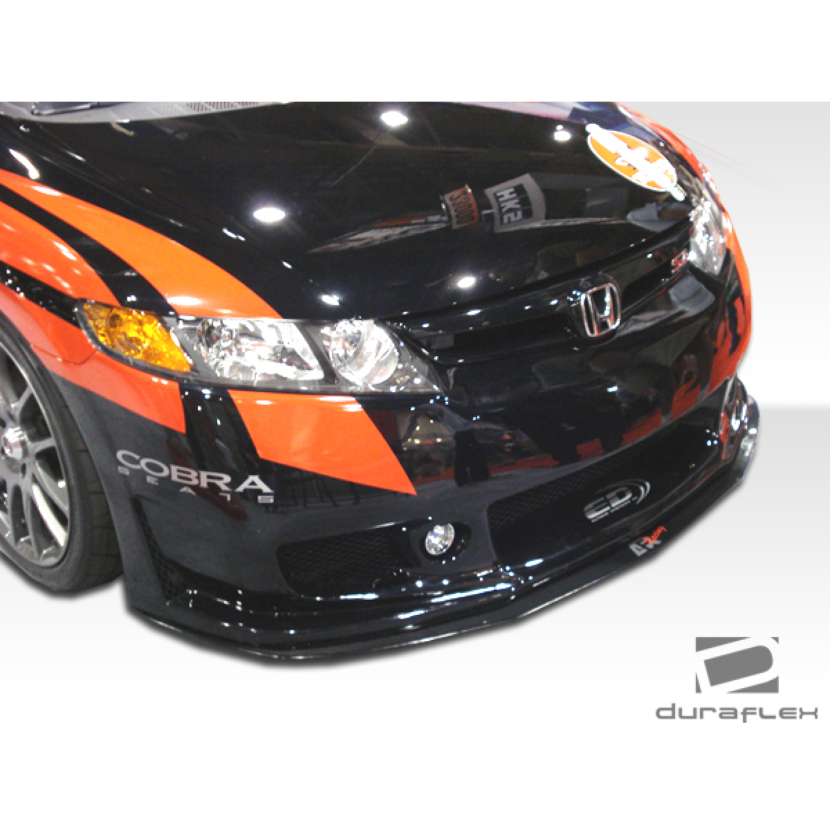 Modify your Honda Civic 2006 with our Exterior/Complete Body Kits - Front angle view of the body kit on the vehicle