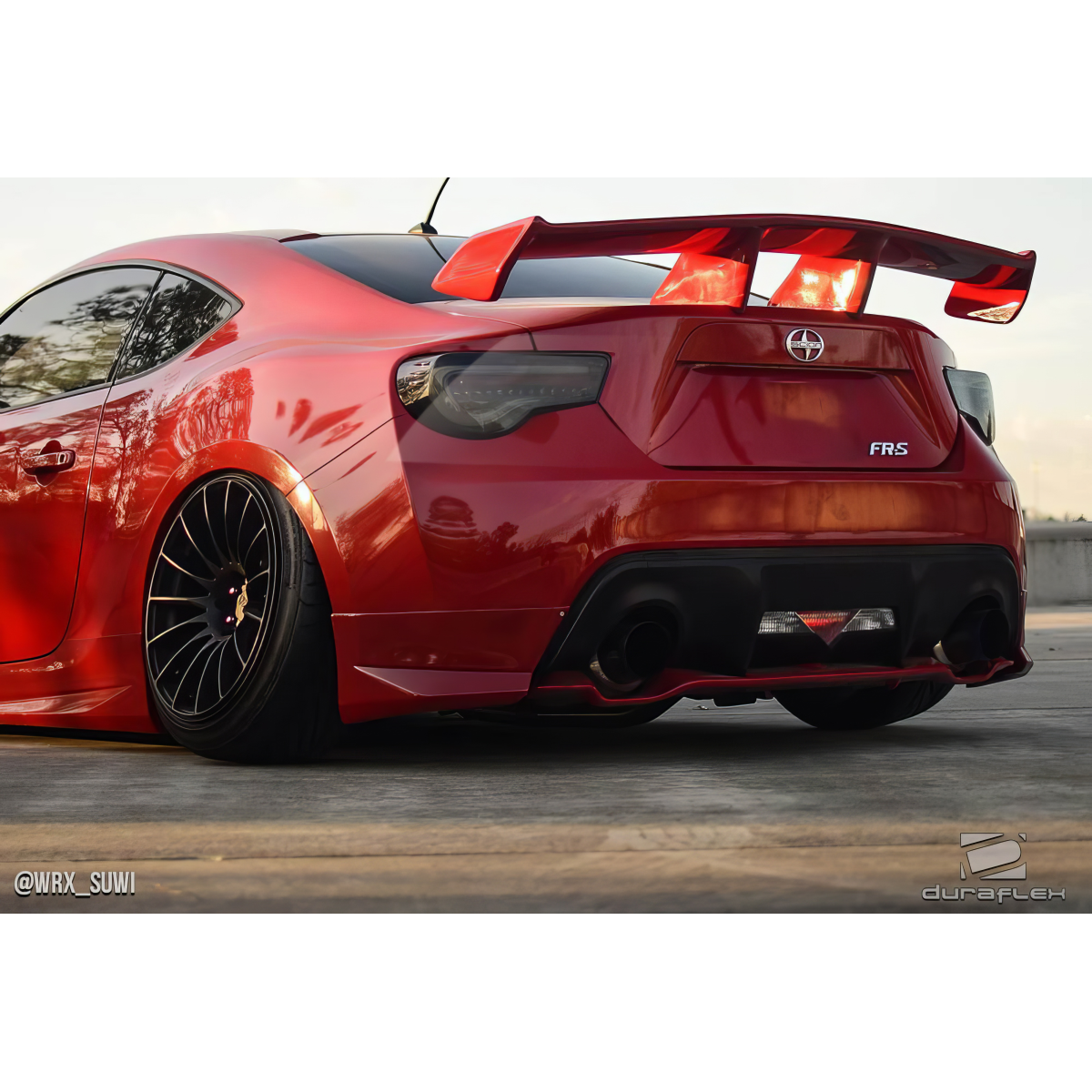 Modify your Scion FR-S 2013 with our Exterior/Complete Body Kits - Low angle view showcasing car's rear and body kit