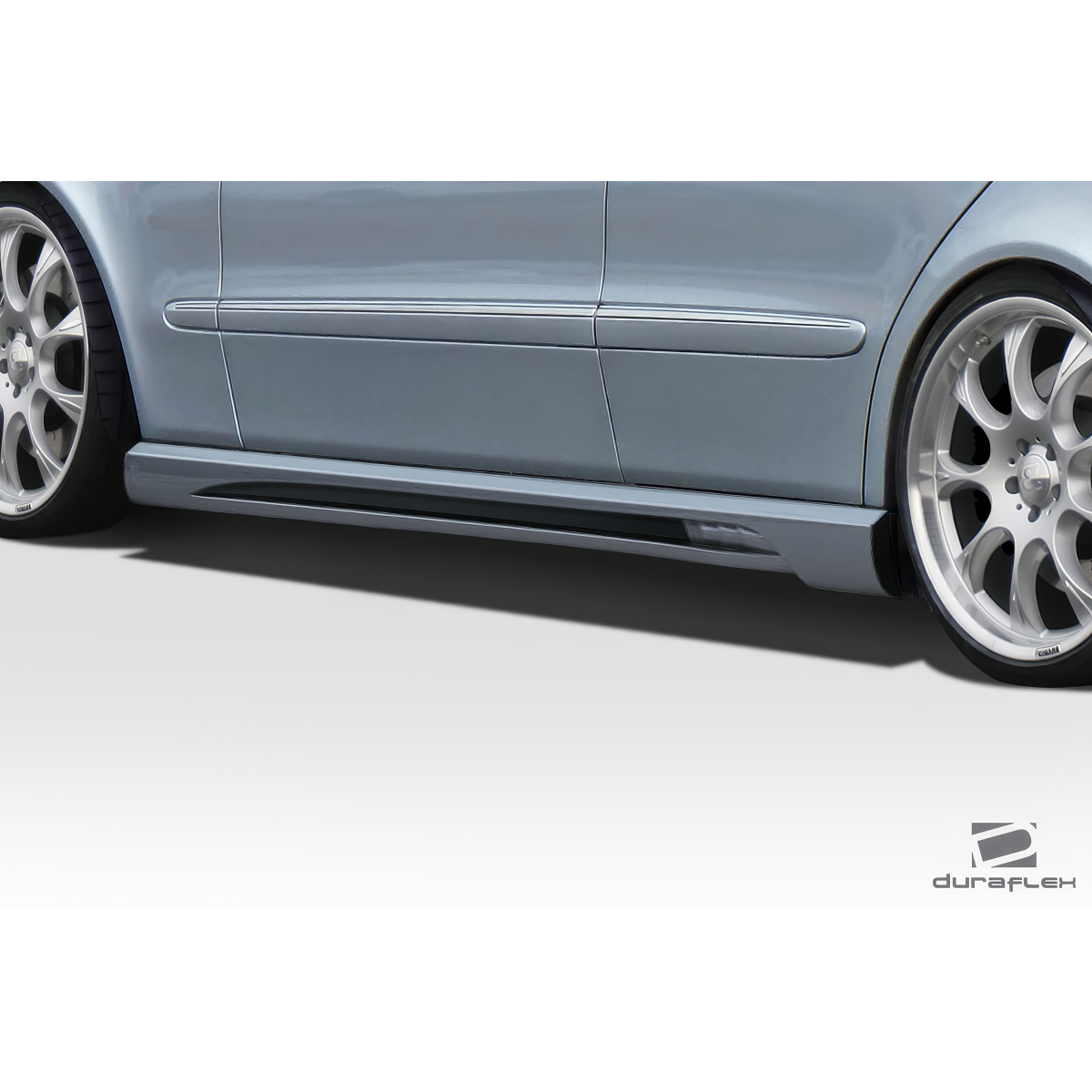 Modify your Mercedes-Benz E55 AMG 2003 with our Exterior/Side Skirts - Side angle view of side skirt attached to vehicle