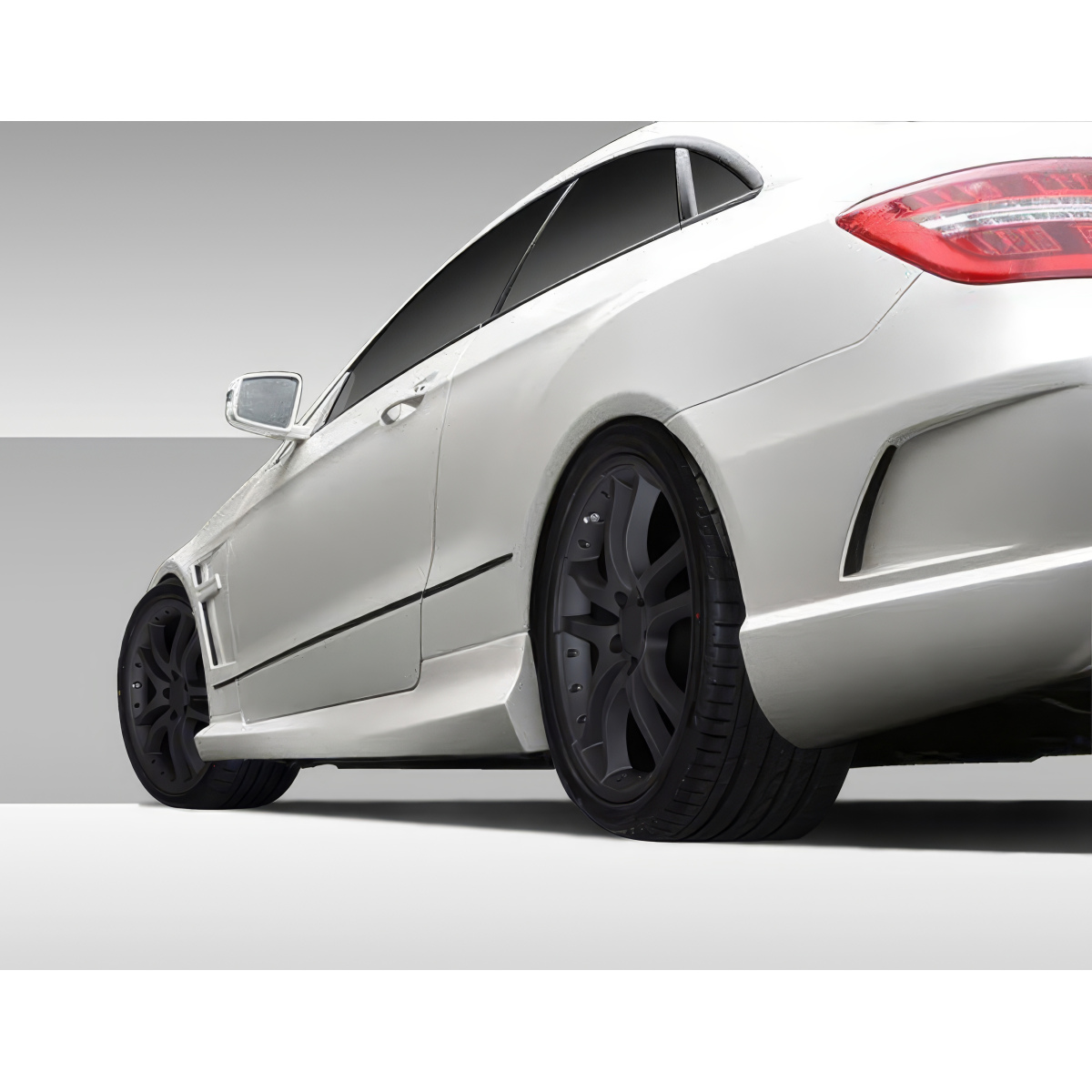 Modify your Mercedes-Benz E-Class 2010 with our Exterior/Side Skirts - Low angle view from the side of the vehicle