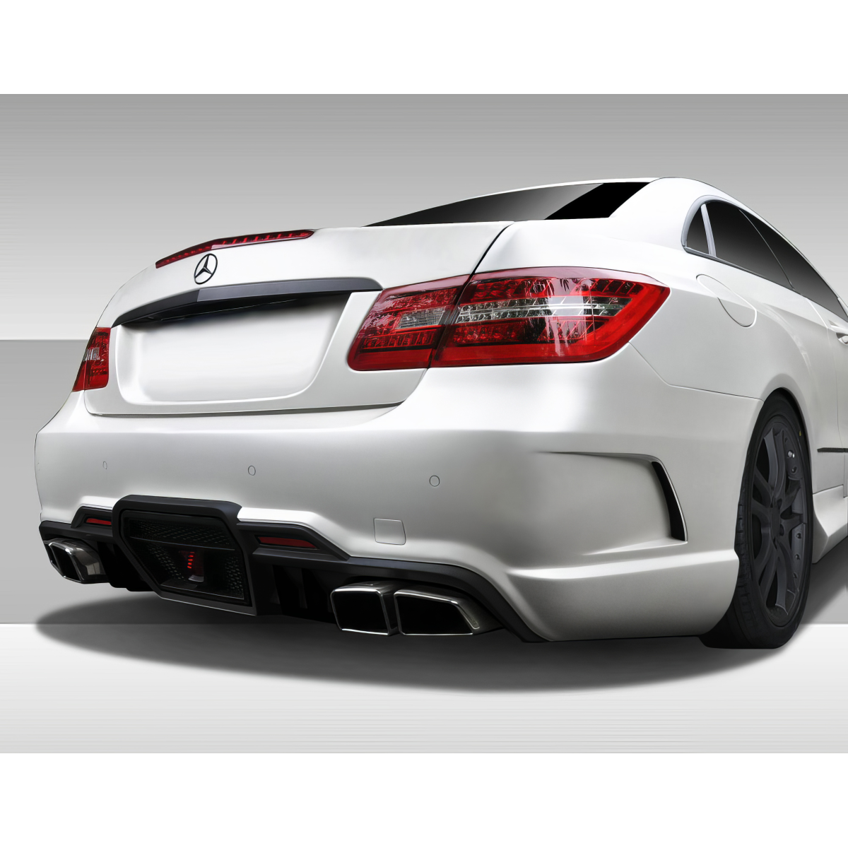 Modify your Mercedes-Benz E-Class 2010 with our Exterior/Rear Bumpers or Lips - The image shows a rear angle view of the car