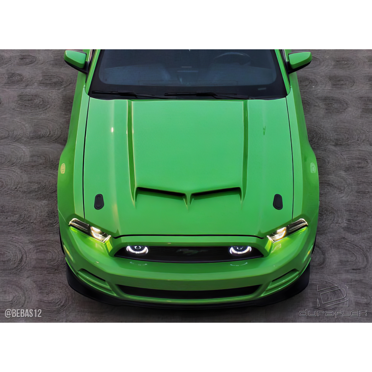 Modify your Ford Mustang 2013 with our Exterior/Hoods - Top down angle of a green Ford Mustang