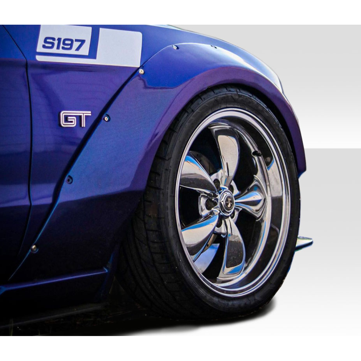 Modify your Ford Mustang 2010 with our Exterior/Complete Body Kits - Close up of vehicle fender at slight angle