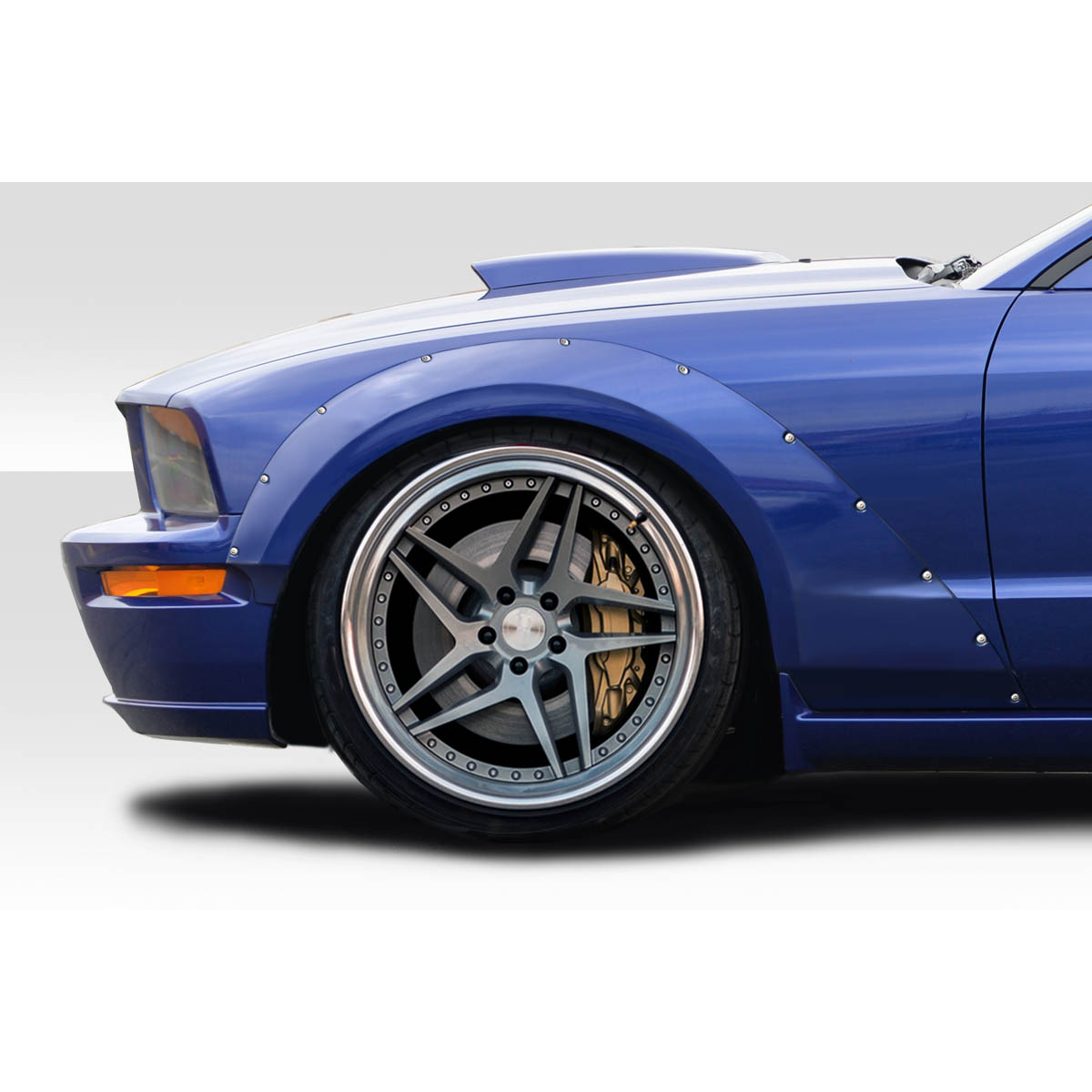 Modify your Ford Mustang 2005 with our Exterior/Fenders - Side angle of a Mustang showing wide body flares