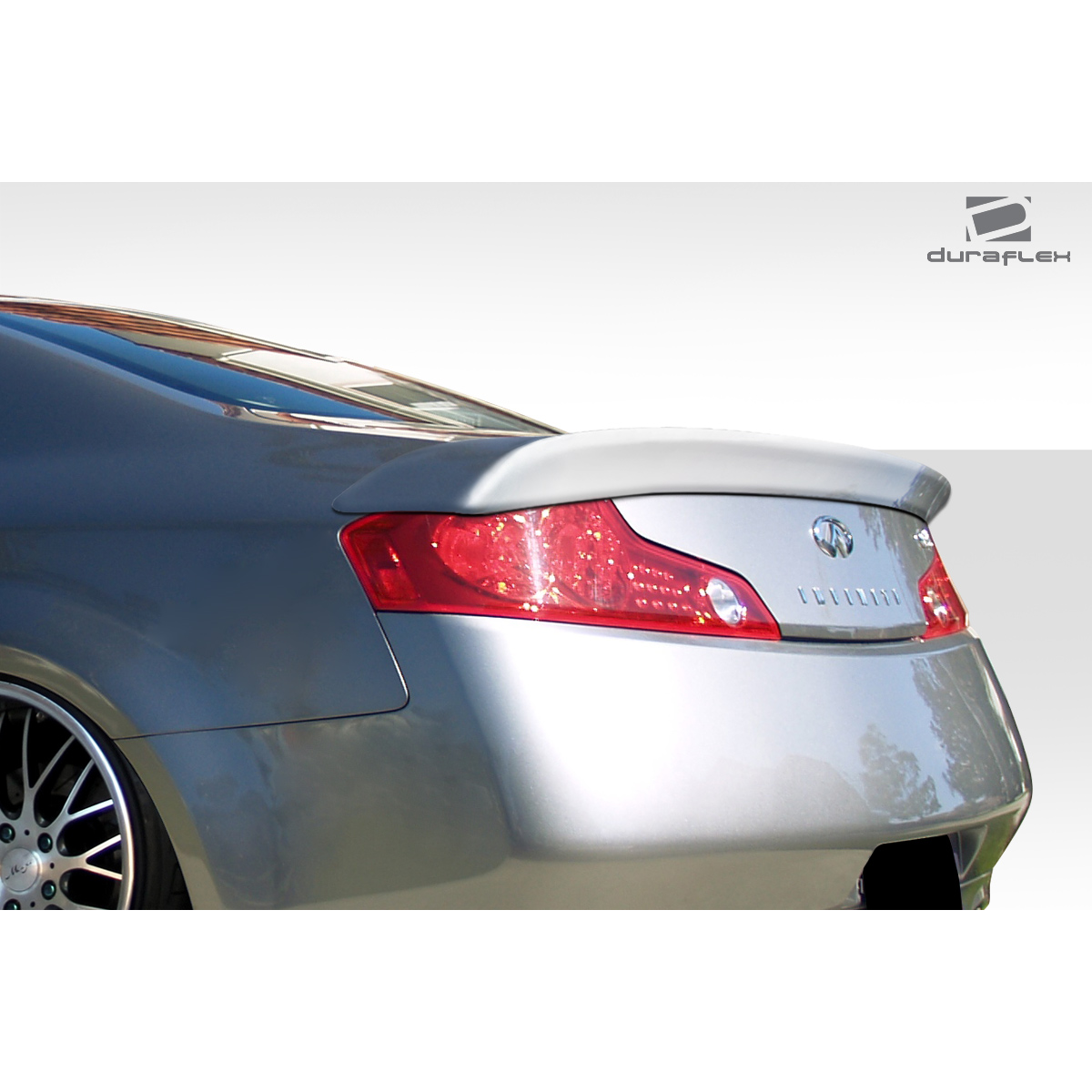 Modify your Infiniti G35 2003 with our Exterior/Wings - Rear angle view of a gray Infiniti G35 coupe