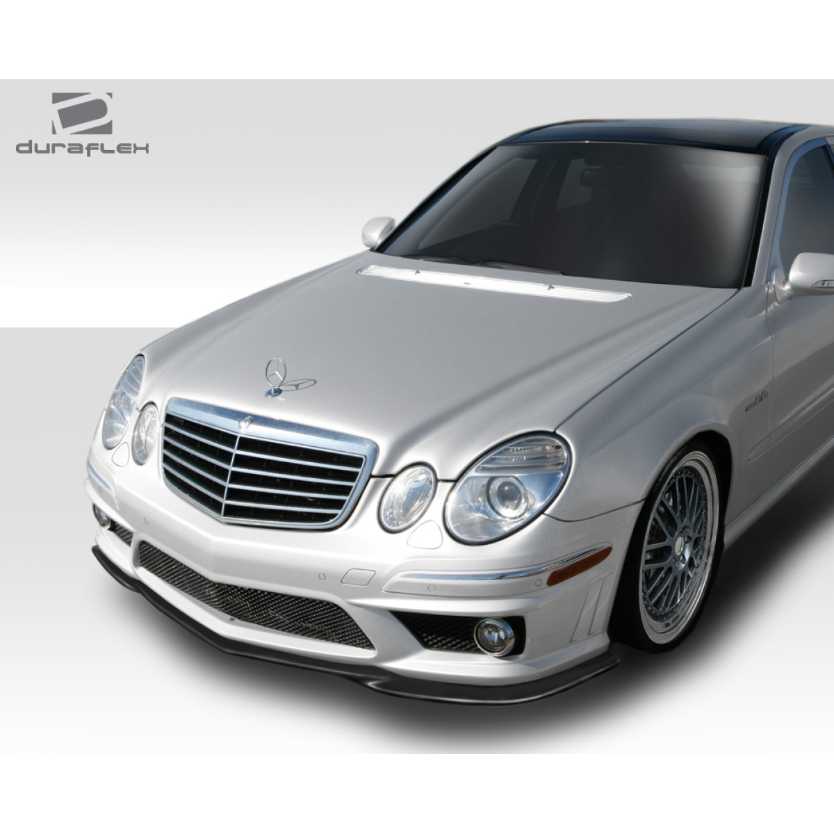 Modify your Mercedes-Benz E55 AMG 2007 with our Exterior/Front Bumpers or Lips - Angled view from the front right side