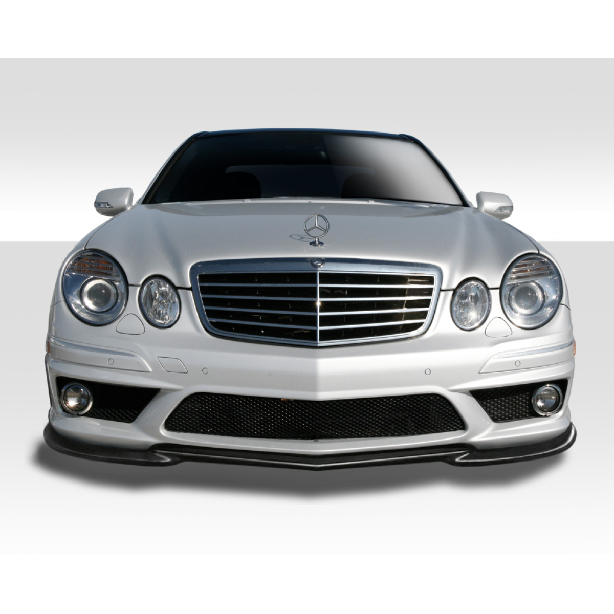 Modify your Mercedes-Benz E55 AMG 2007 with our Exterior/Front Bumpers or Lips - Front angle view of a Mercedes E55 AMG