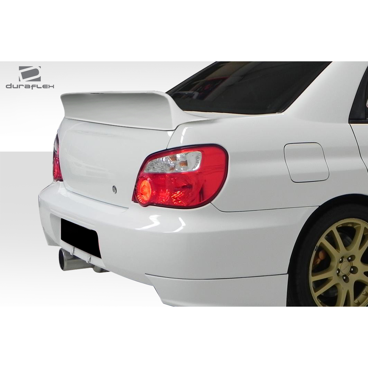 Modify your Subaru Impreza 2002 with our Exterior/Wings - Rear angle view of the wing spoiler on the car