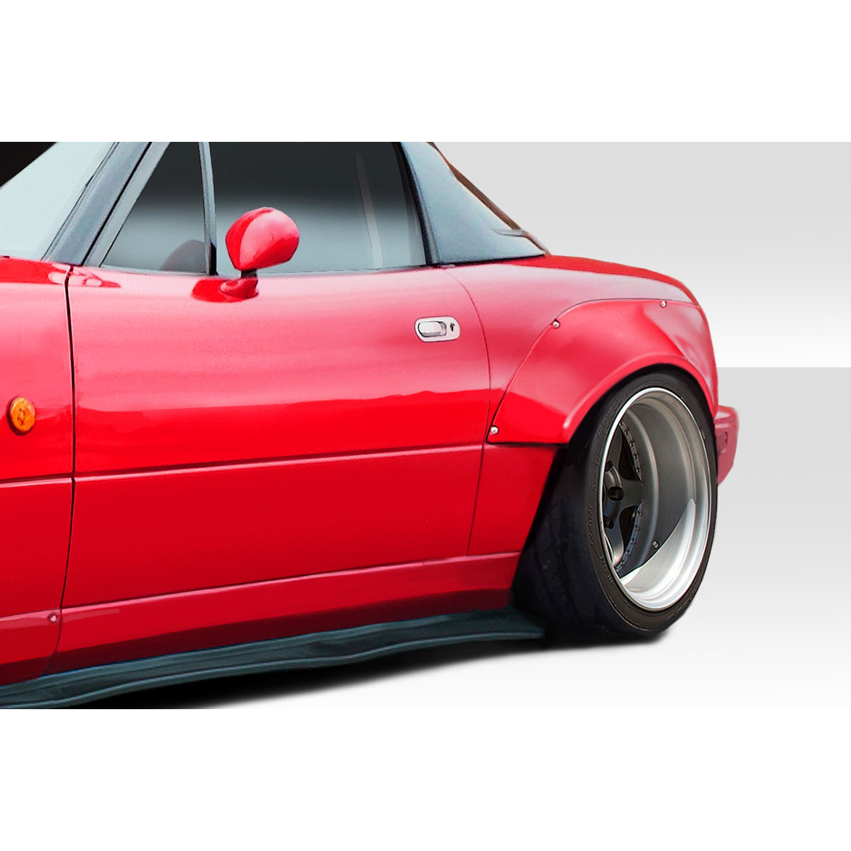 Modify your Mazda Miata 1990 with our Exterior/Fenders - Angled view of a red Mazda Miata fender flare