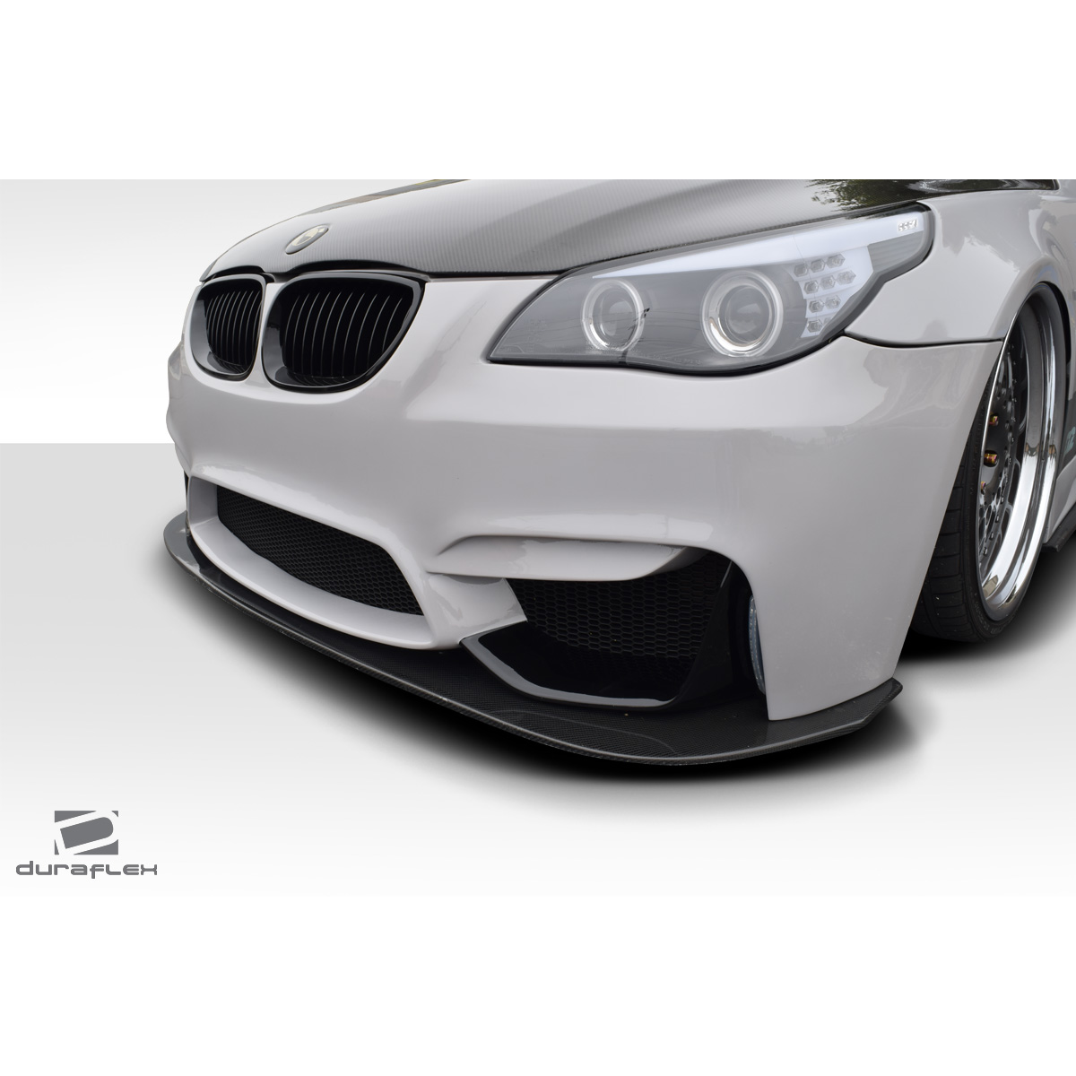 Modify your BMW 5-Series 2004 with our Exterior/Front Bumpers or Lips - Low angle view highlighting front bumper design