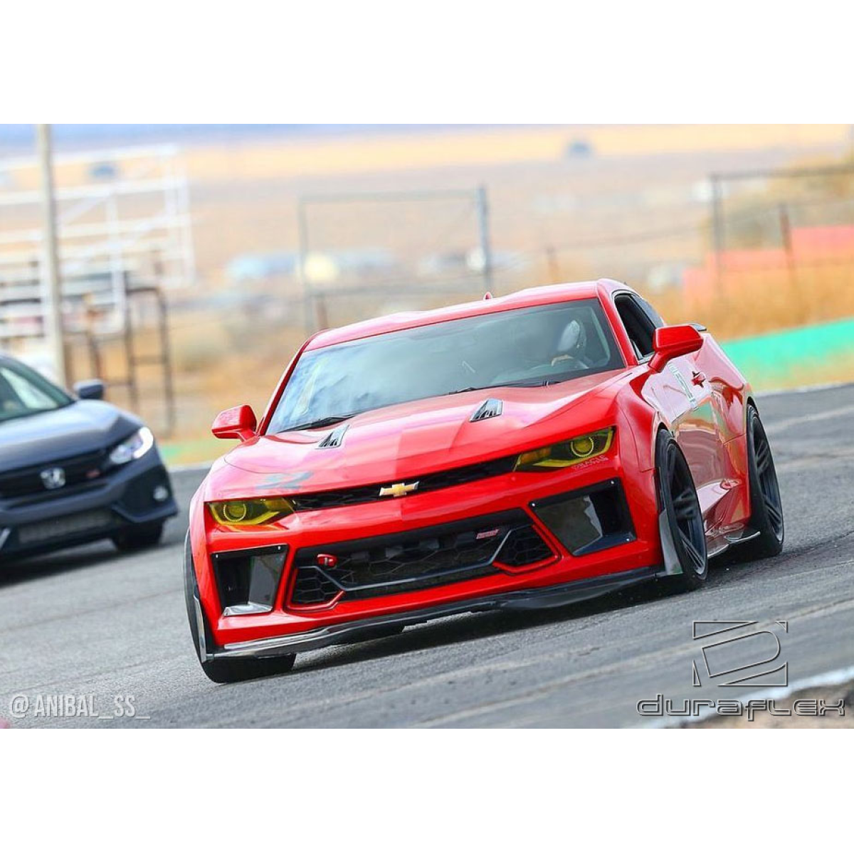 Modify your Chevrolet Camaro 2016 with our Exterior/Front Bumpers - Car viewed from front angle on track