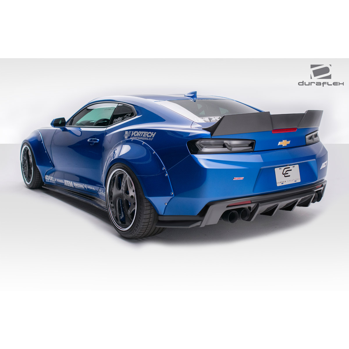 Modify your Chevrolet Camaro 2016 with our Exterior/Complete Body Kits - The image shows the car from a 3/4 rear angle