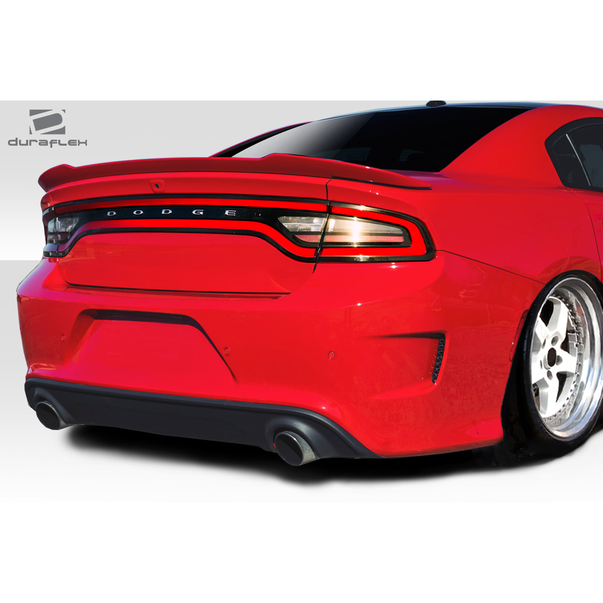 Modify your Dodge Charger 2015 with our Exterior/Rear Bumpers or Lips - Rear view of the vehicle at a slight angle