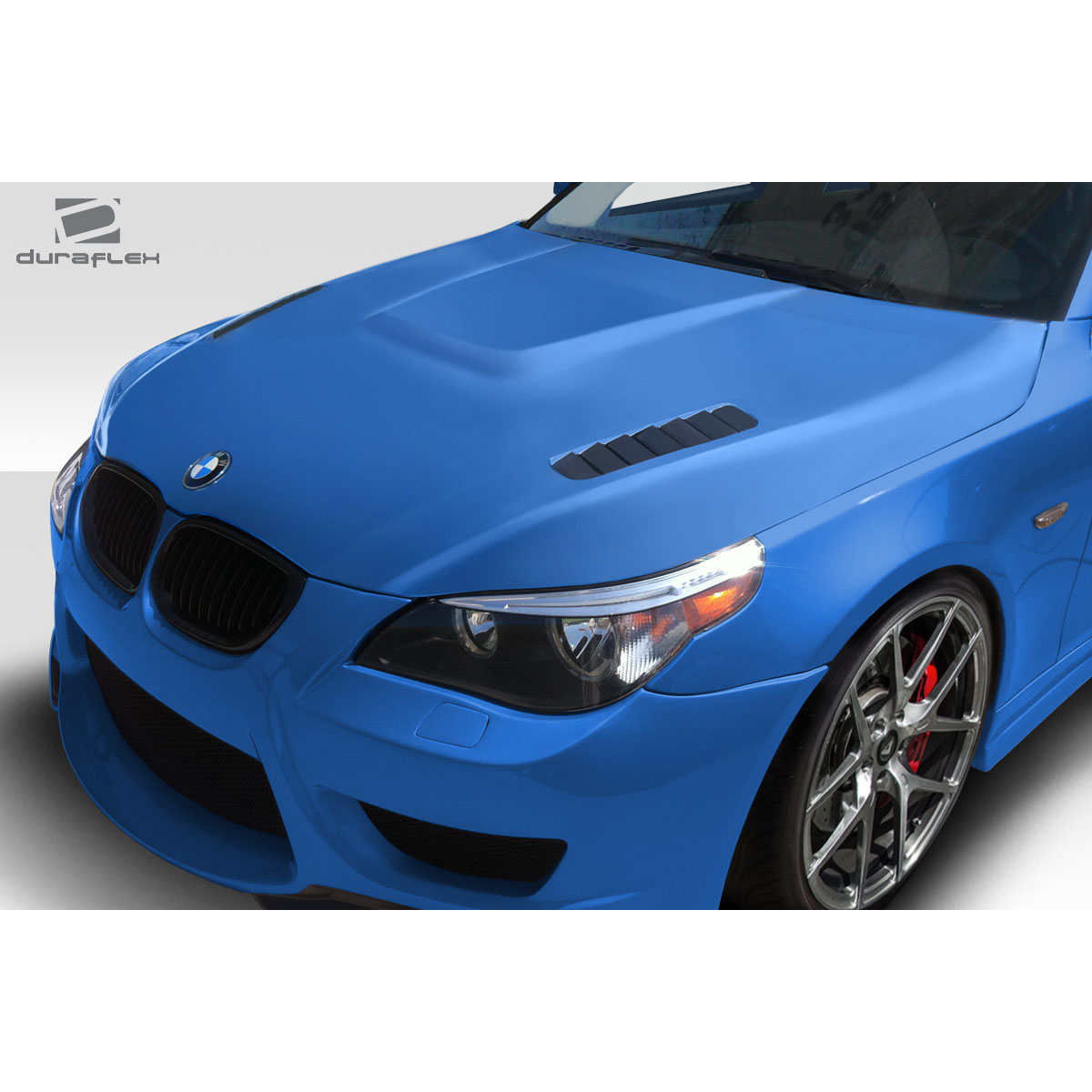 Modify your BMW 5-Series 2004 with our Exterior/Hoods - Front angle of the vehicle with focus on the hood