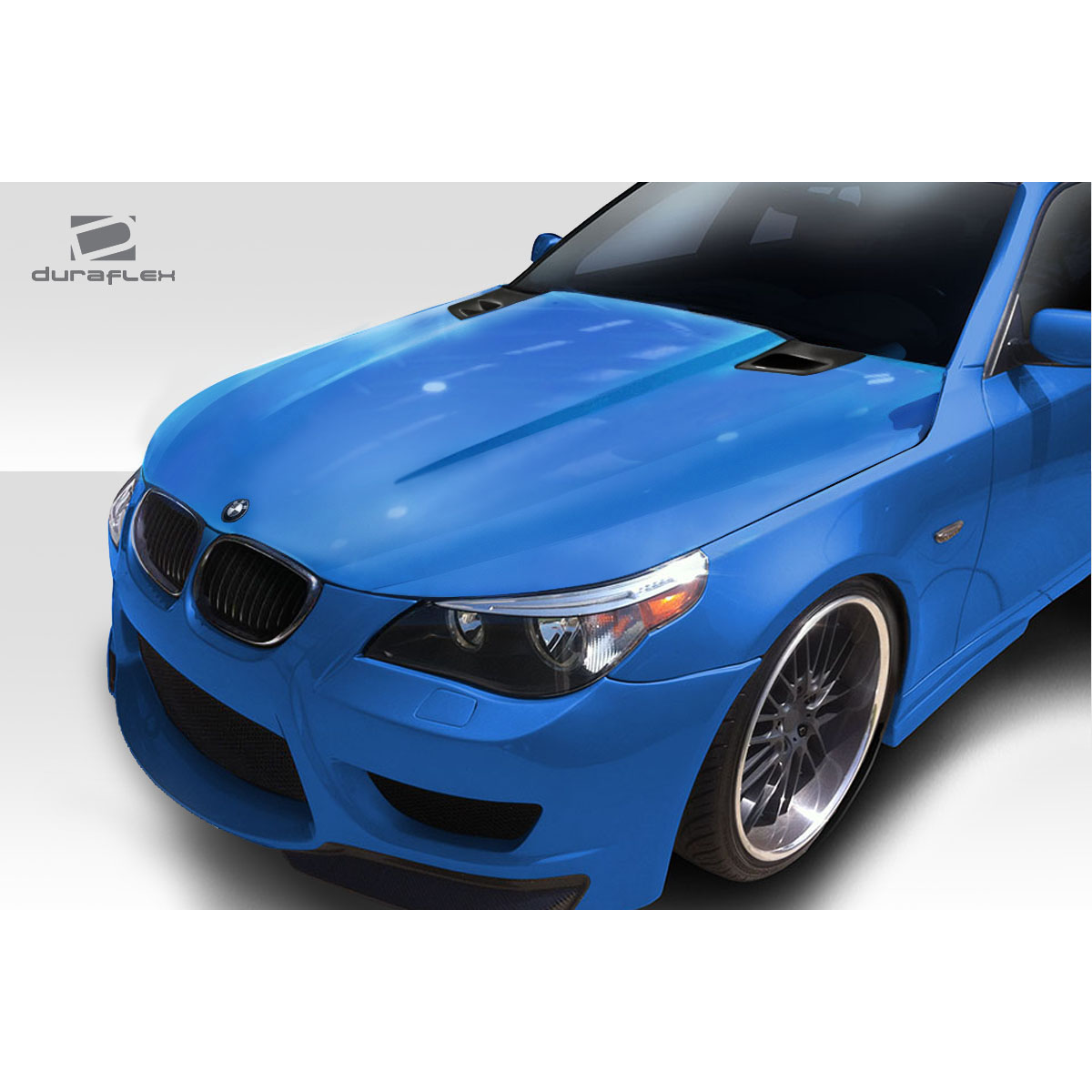 Modify your BMW 5-Series 2004 with our Exterior/Hoods - Angled view of blue BMW 5 Series hood