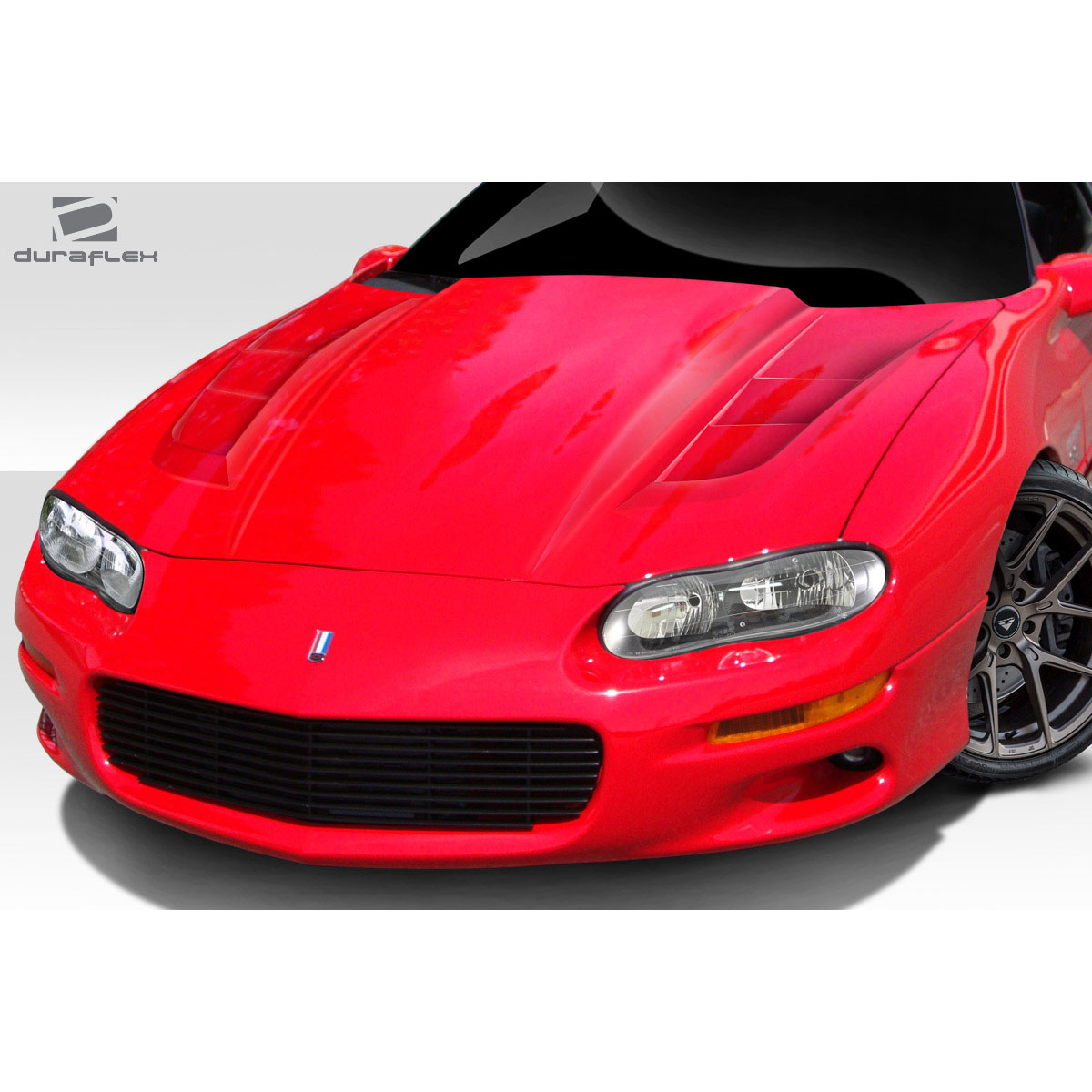 Modify your Chevrolet Camaro 1998 with our Exterior/Hoods - Front angle view of a red Chevrolet Camaro hood