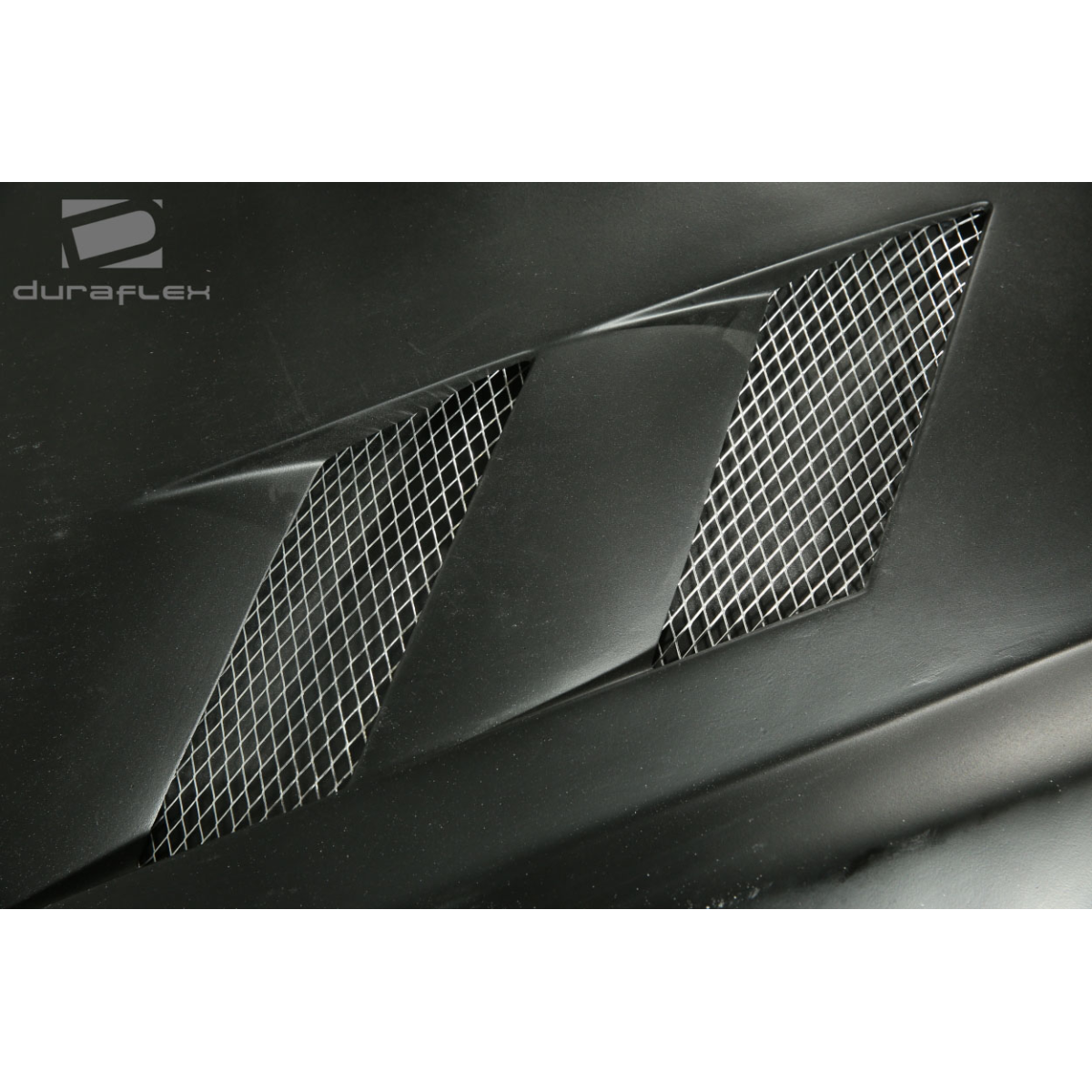 Modify your Hyundai Tiburon 2003 with our Exterior/Hoods - Angled view of a car hood vent part