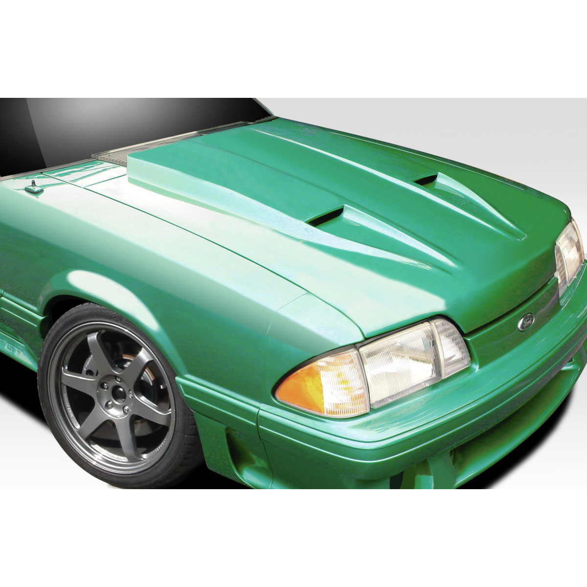 Modify your Ford Mustang 1987 with our Exterior/Hoods - Angled view of a green Mustang hood