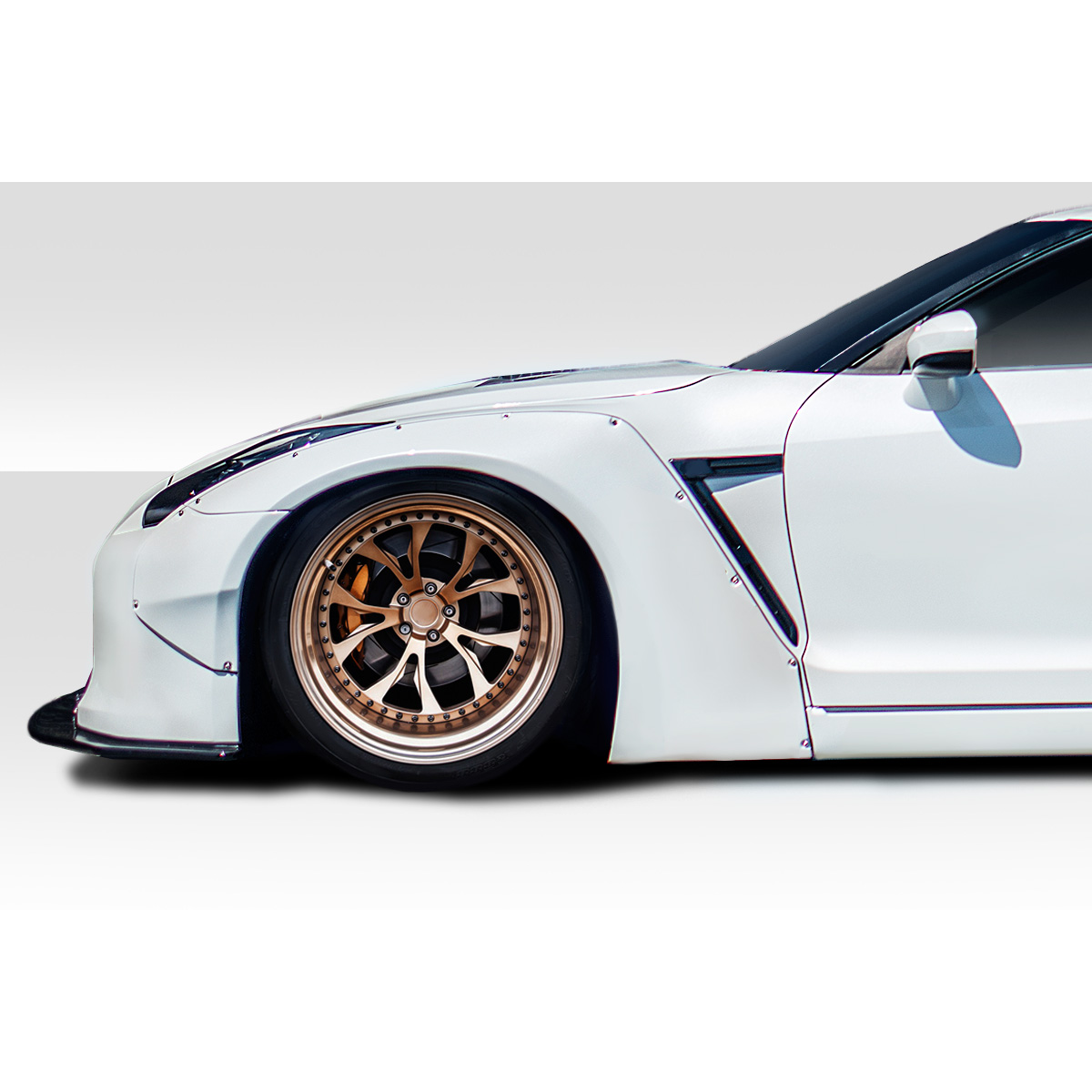 Modify your Nissan GT-R 2009 with our Exterior/Complete Body Kits - Side angle view of car fender and wheel